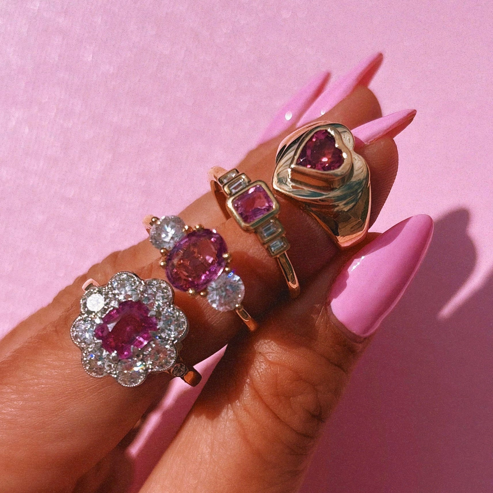 18ct gold 0.52ct emerald cut pink sapphire and baguette diamond three stone ring