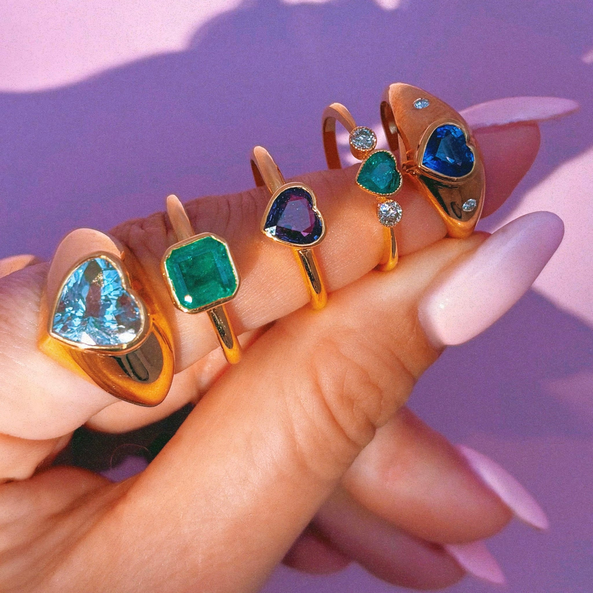 14ct gold heart-shaped emerald and diamond three stone ring