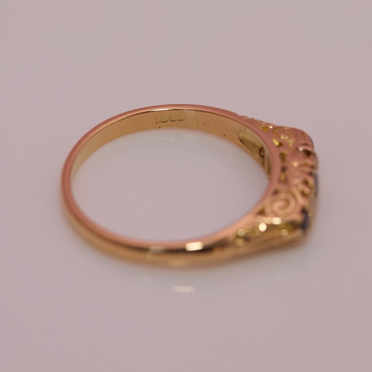 18ct gold sapphire and diamond carved ring