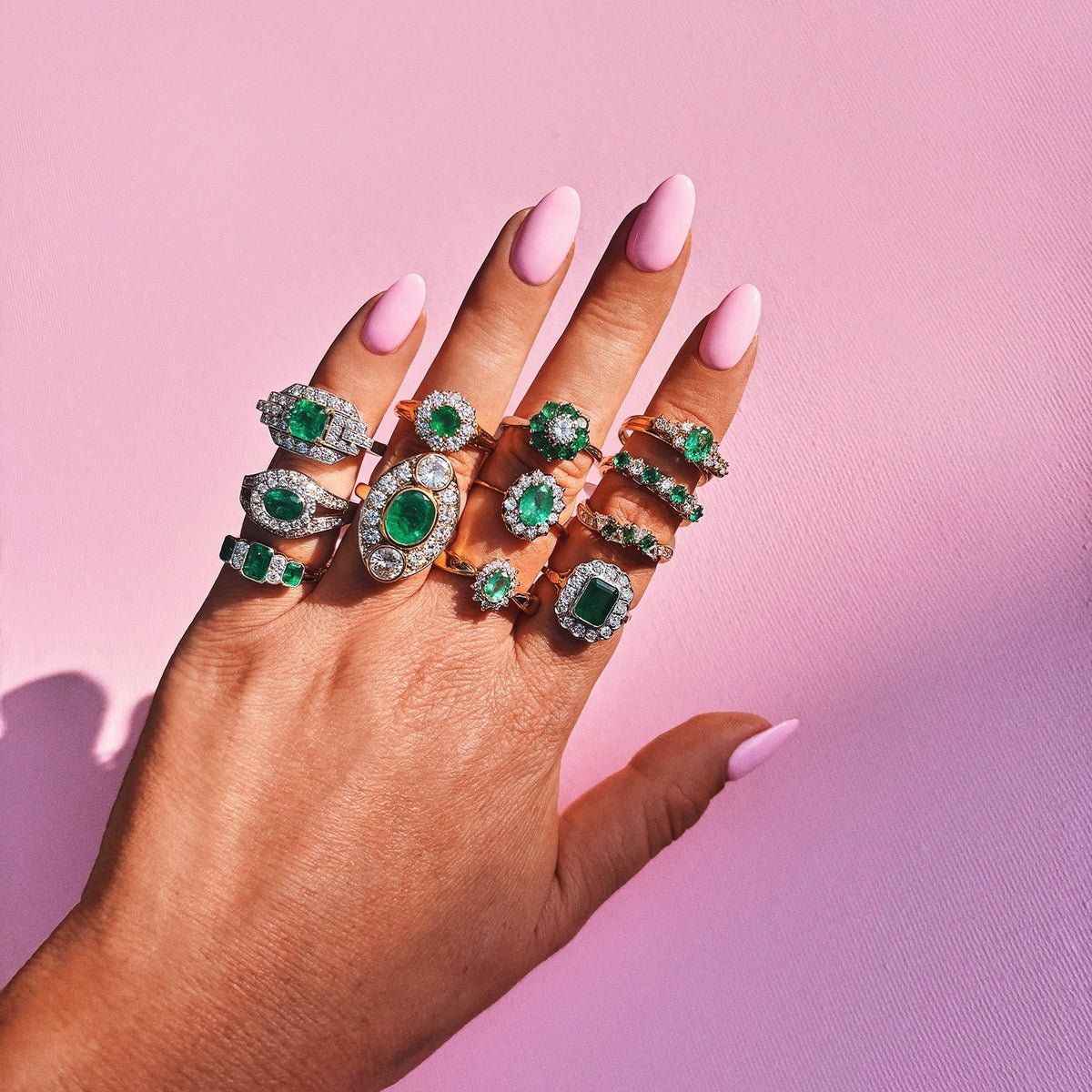 Vintage 18ct gold emerald and diamond cluster ring with a graduated band