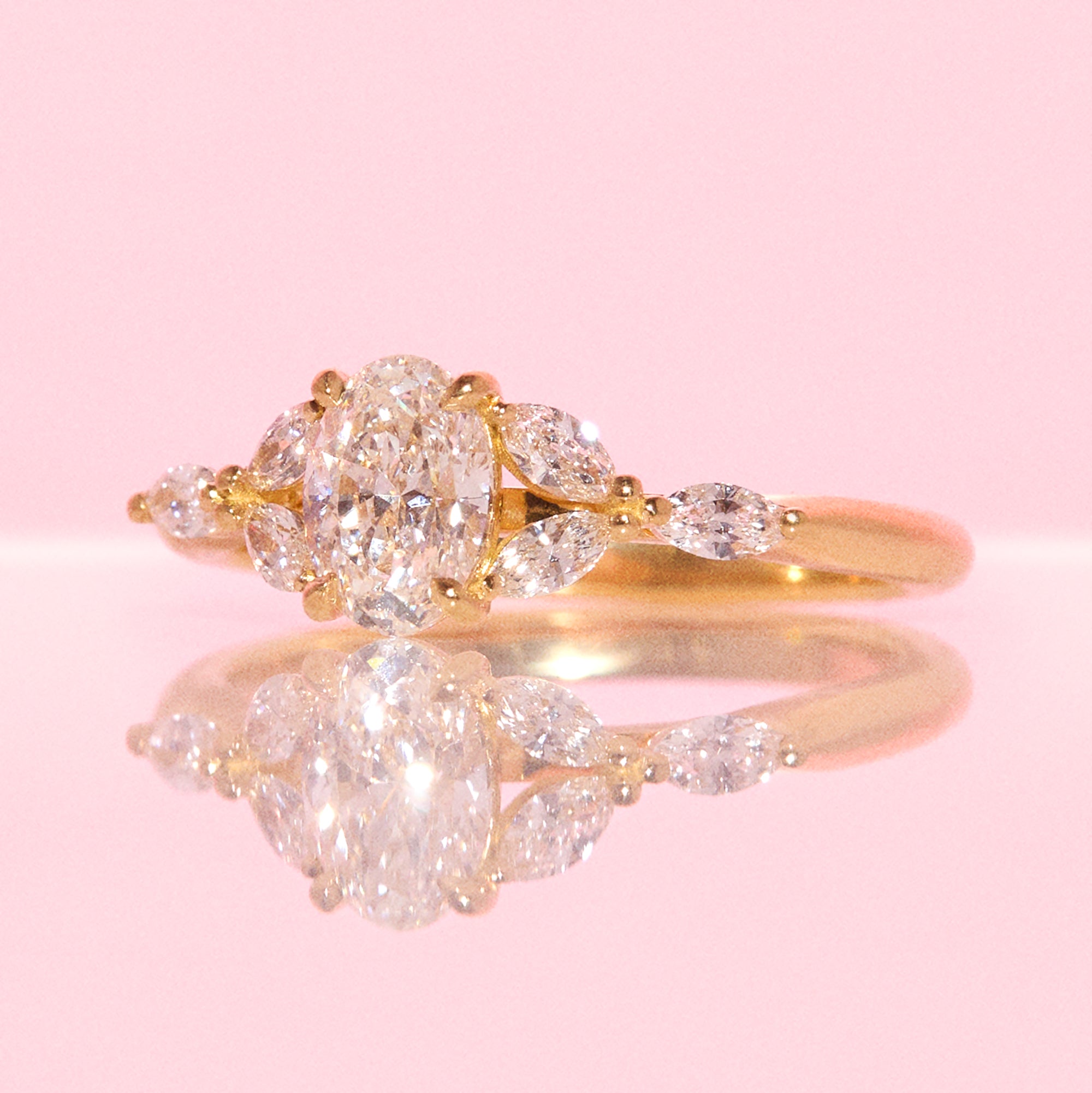 18ct gold 0.70ct oval diamond cluster ring (made to order)