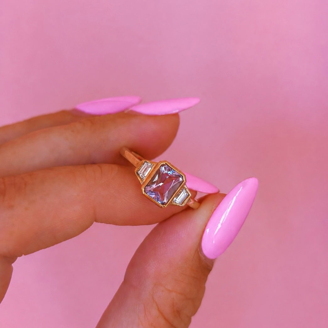 9ct gold 0.94ct emerald cut amethyst and 0.17ct diamond ring