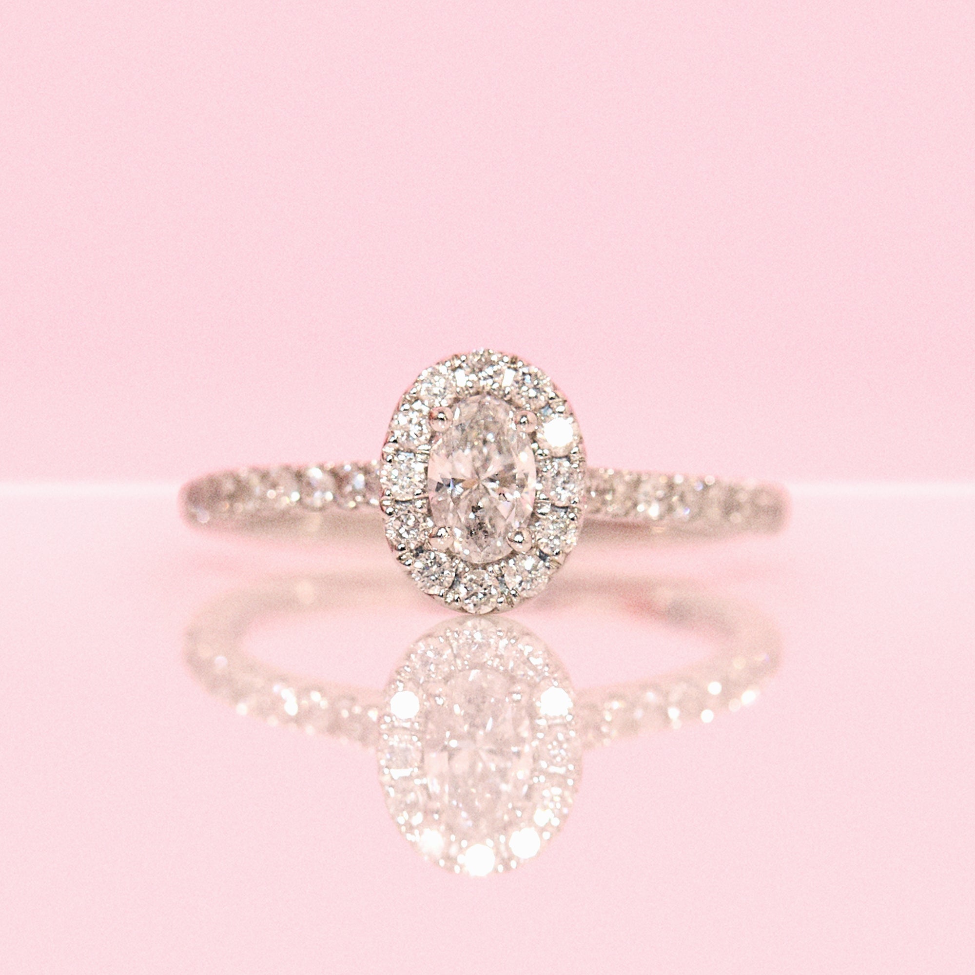 Platinum 0.62ct oval half-eternity diamond ring