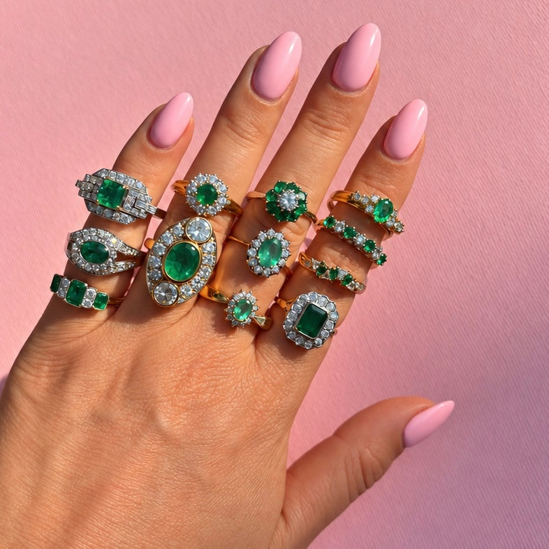 Vintage 18ct gold emerald and diamond cluster ring with a graduated band