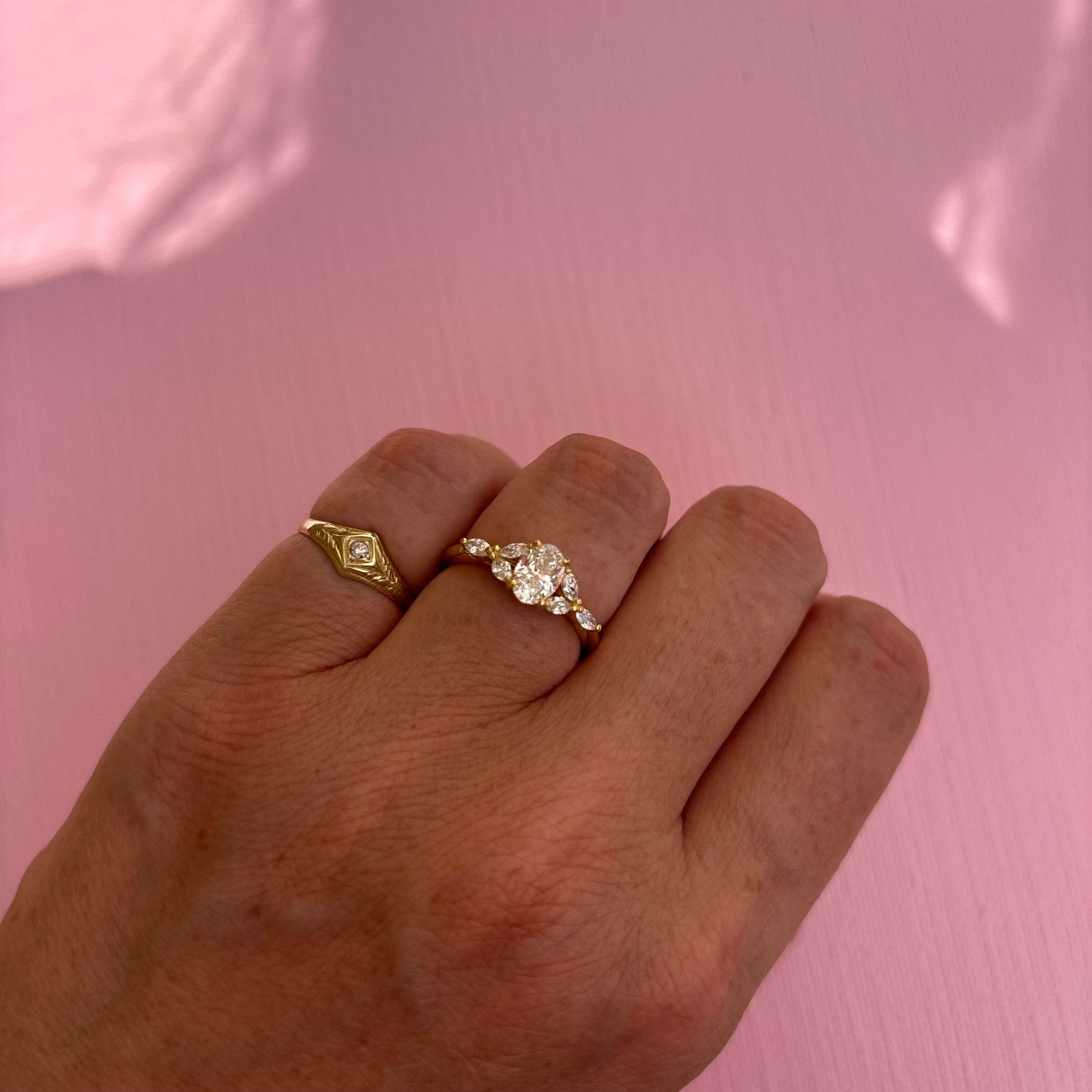 18ct gold 0.70ct oval diamond cluster ring (made to order)
