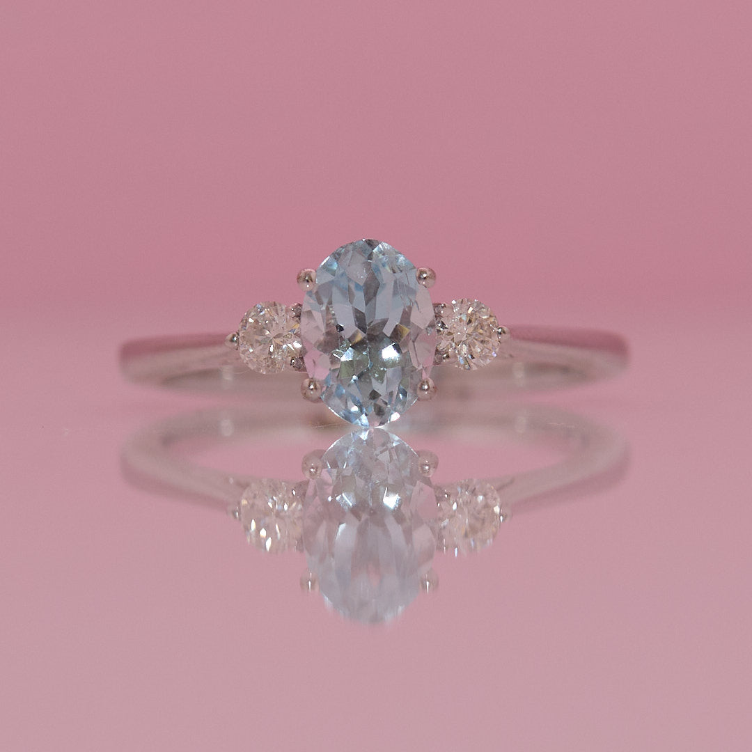 9ct white gold 1.03ct aquamarine and 0.16ct diamond three stone ring