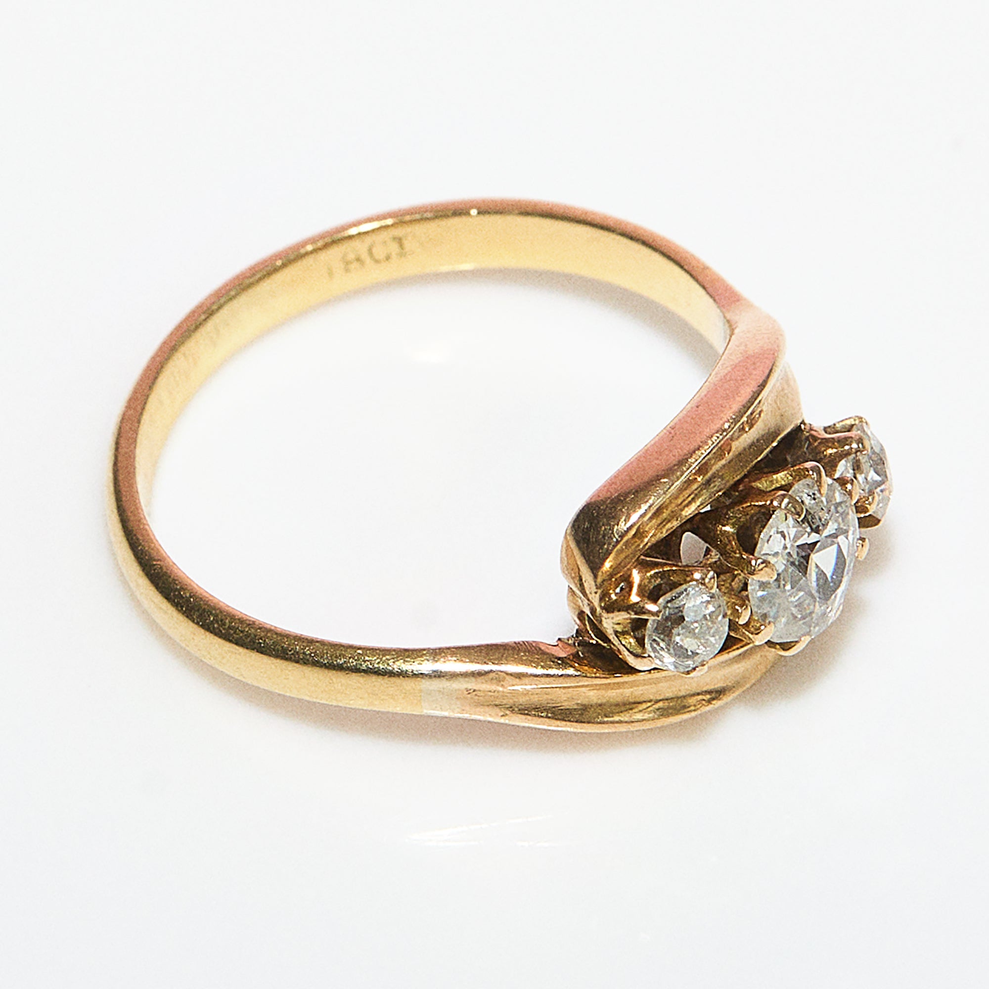 18ct gold old cut diamond three stone cross over ring
