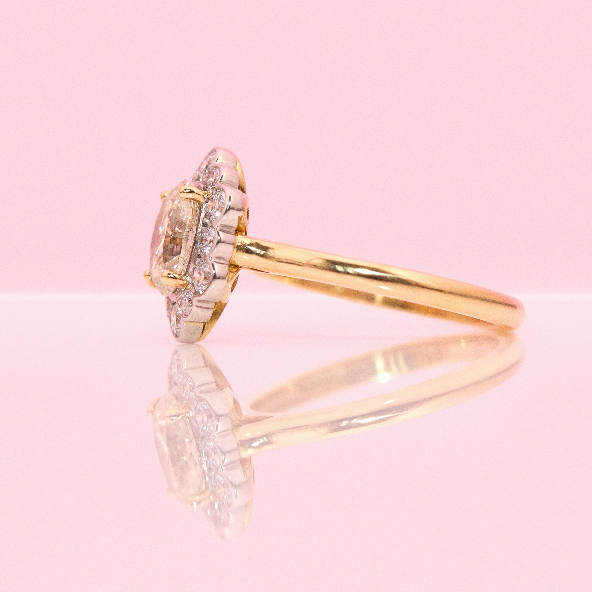 18ct gold 1.20ct oval diamond flower ring