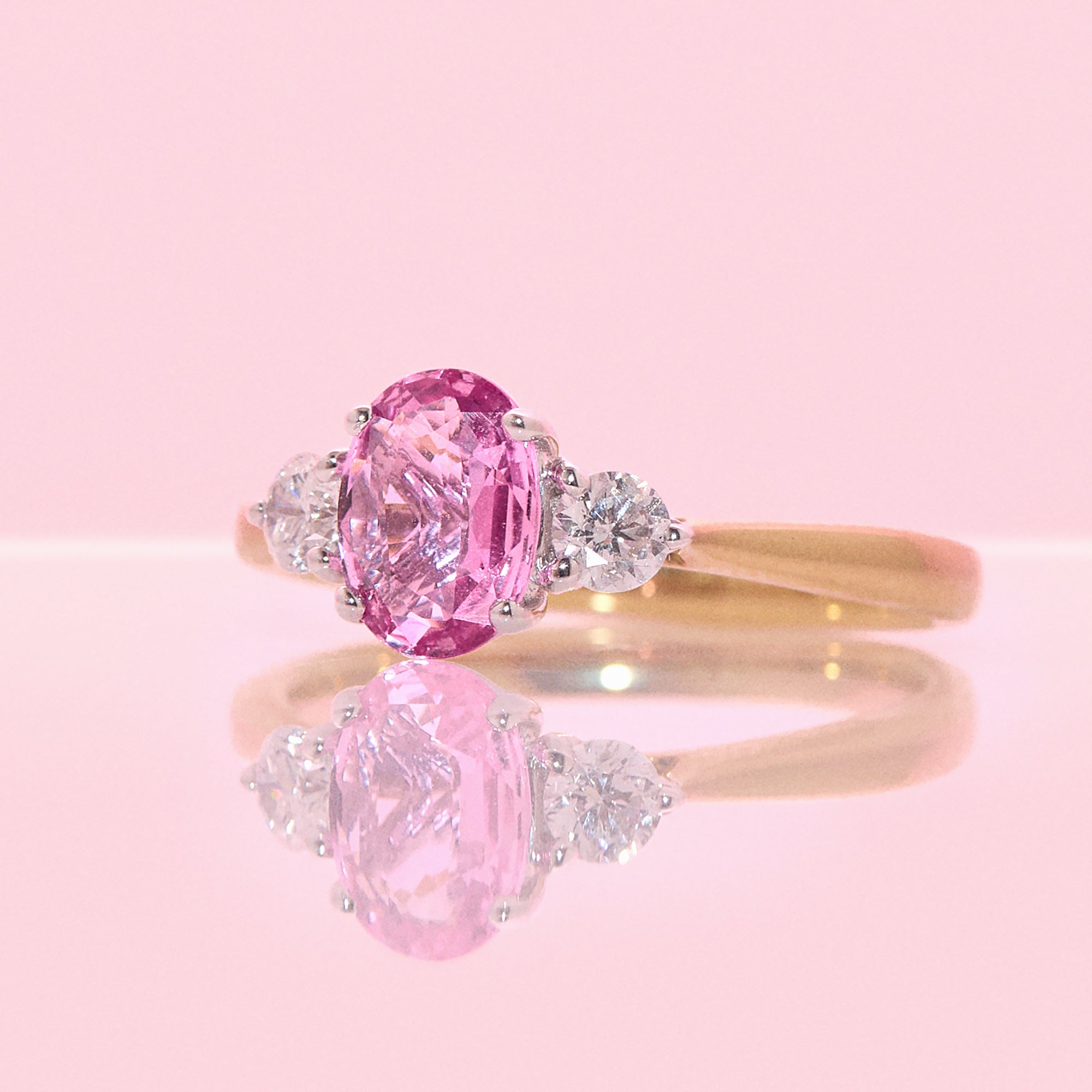 18ct gold 1.22ct pink sapphire and 0.25ct diamond three stone ring