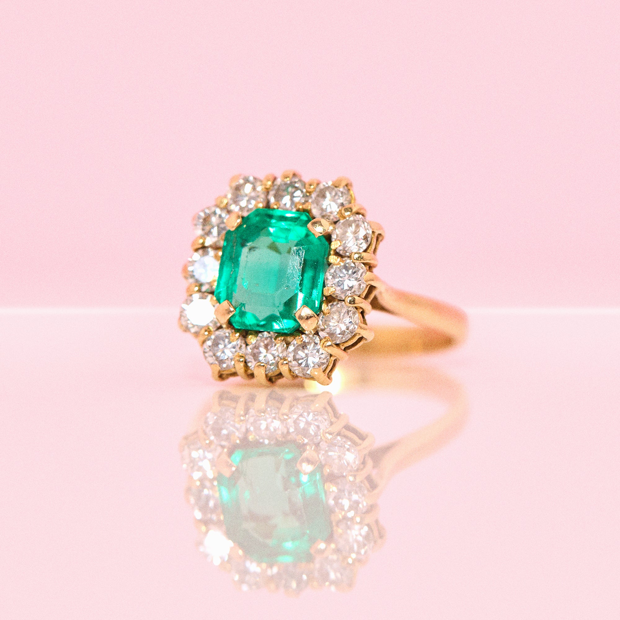 18ct gold emerald and diamond cluster ring
