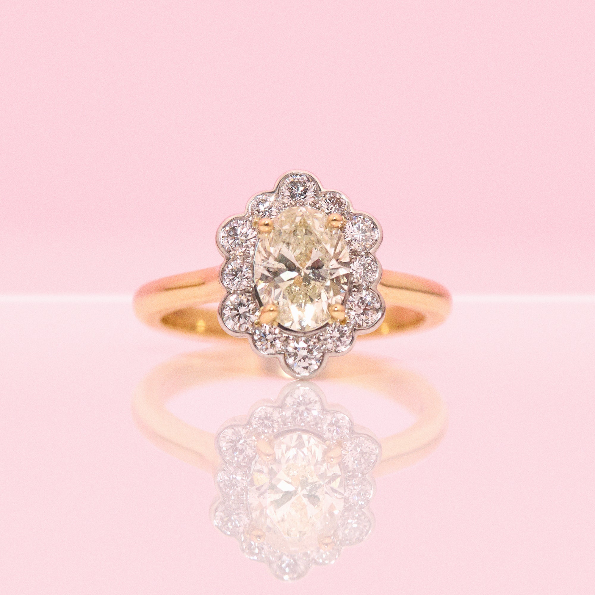 18ct gold 1.20ct oval diamond flower ring