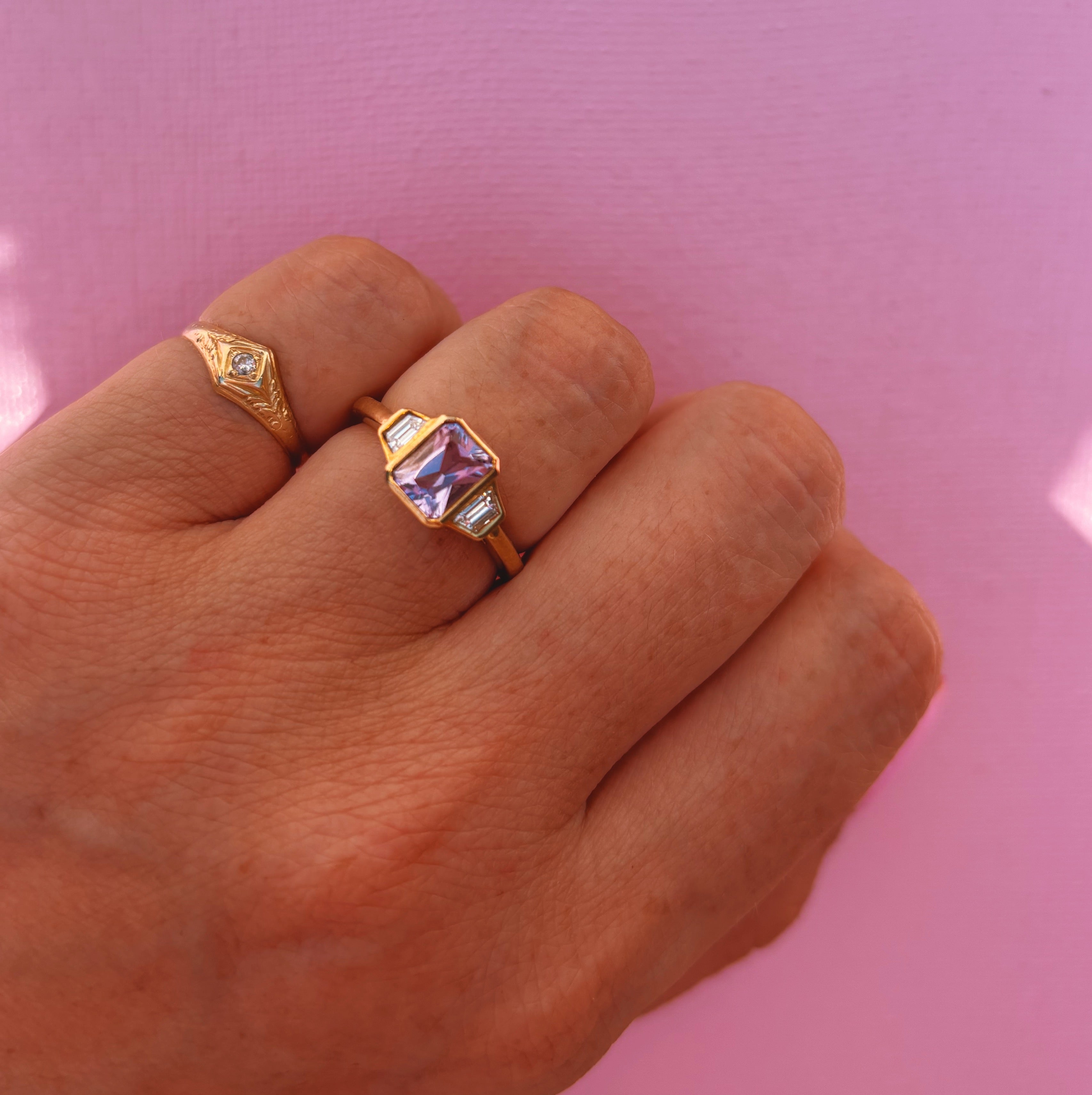 9ct gold 0.94ct emerald cut amethyst and 0.17ct diamond ring