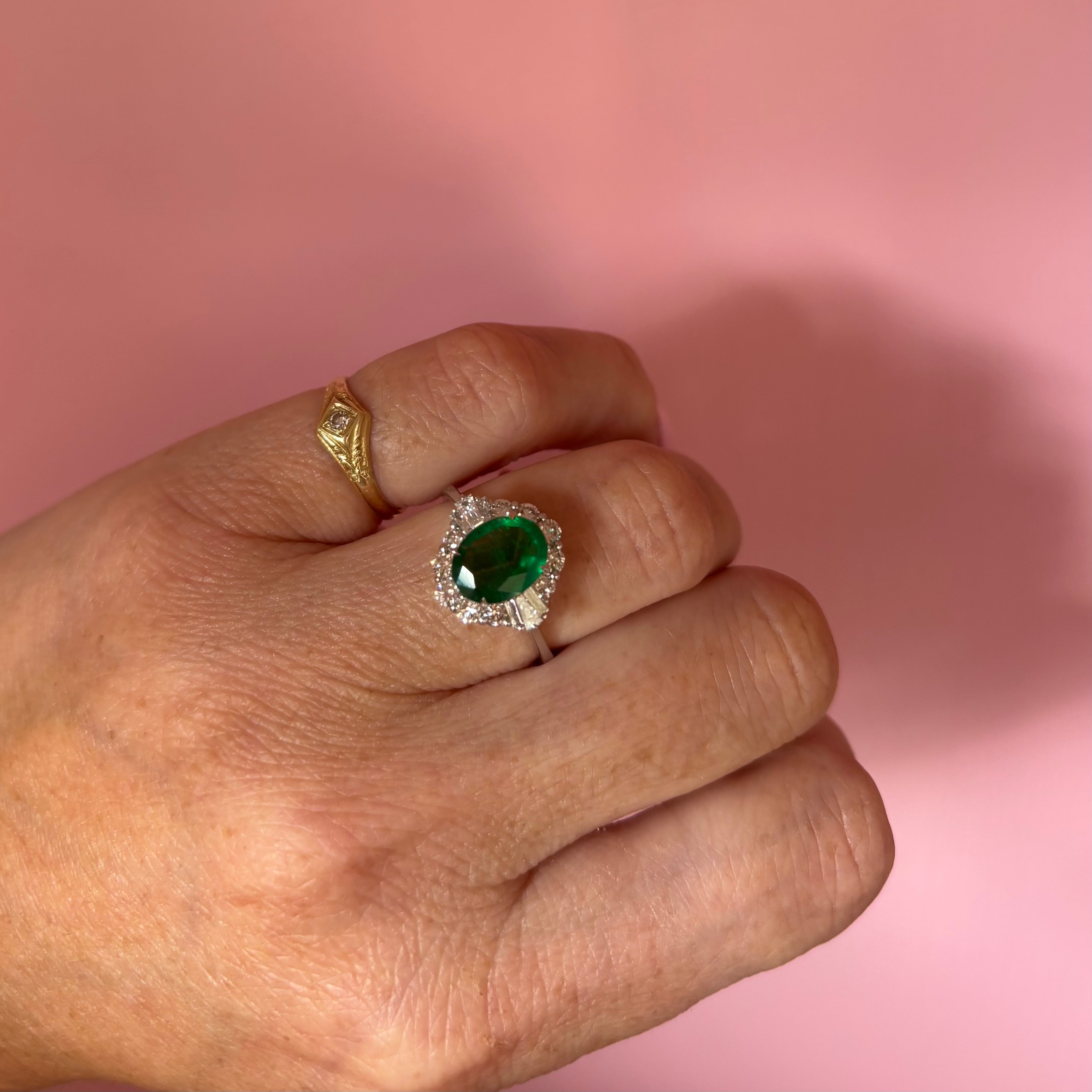 18ct white gold oval emerald and baguette diamond cluster ring