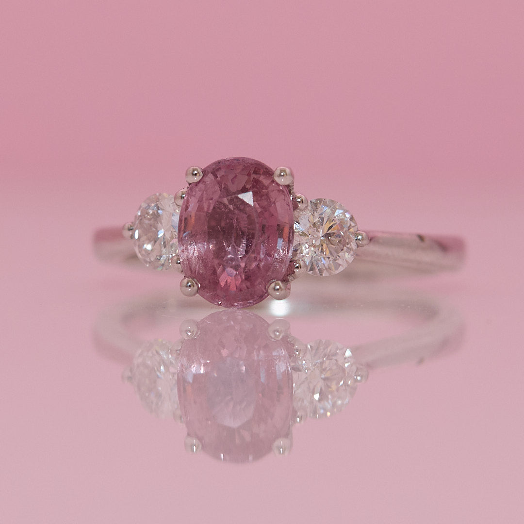 Platinum 1.24ct pink sapphire and 0.43ct diamond three stone ring