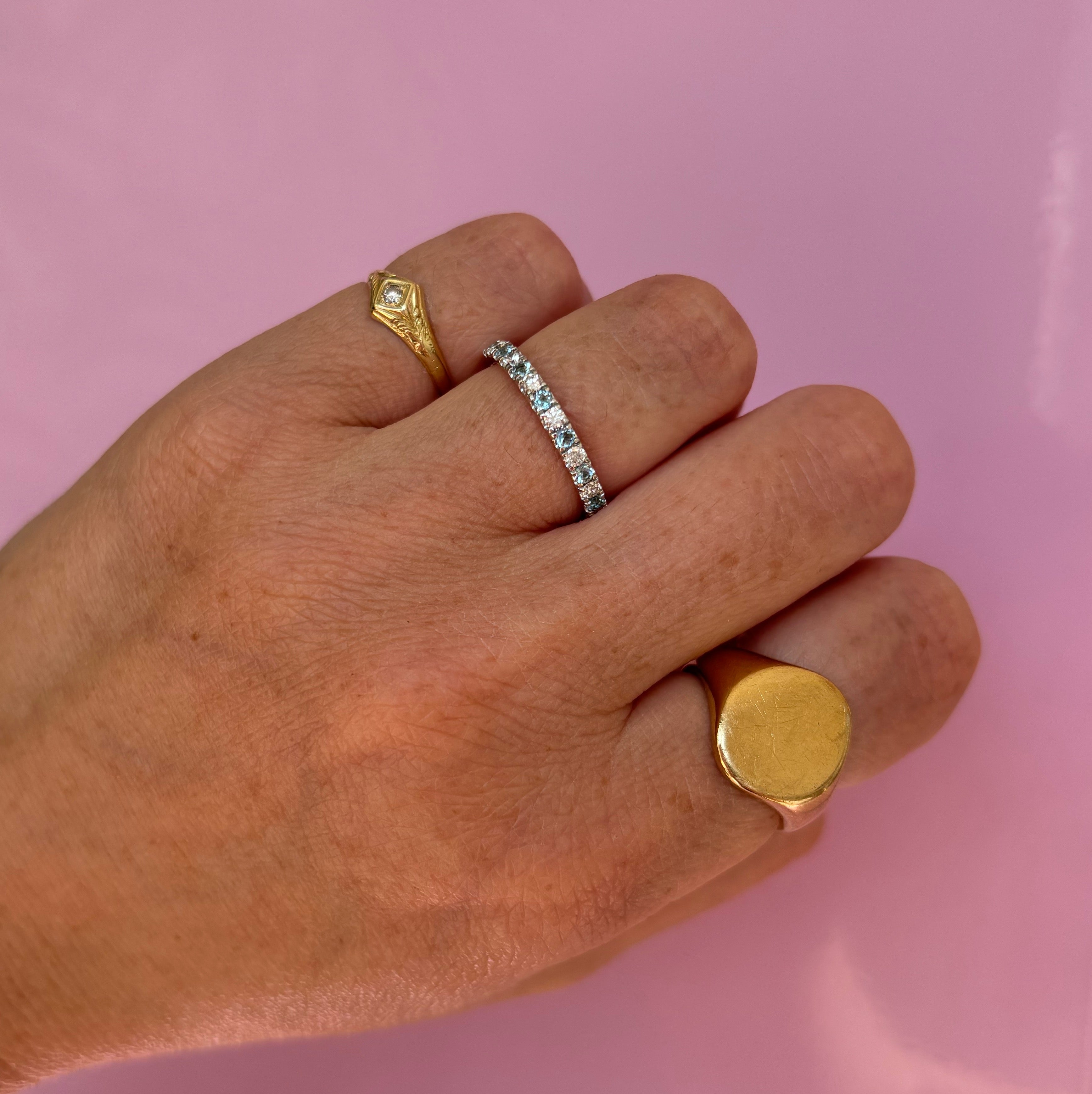 9ct gold 0.30ct blue topaz and 0.21ct diamond half-eternity ring