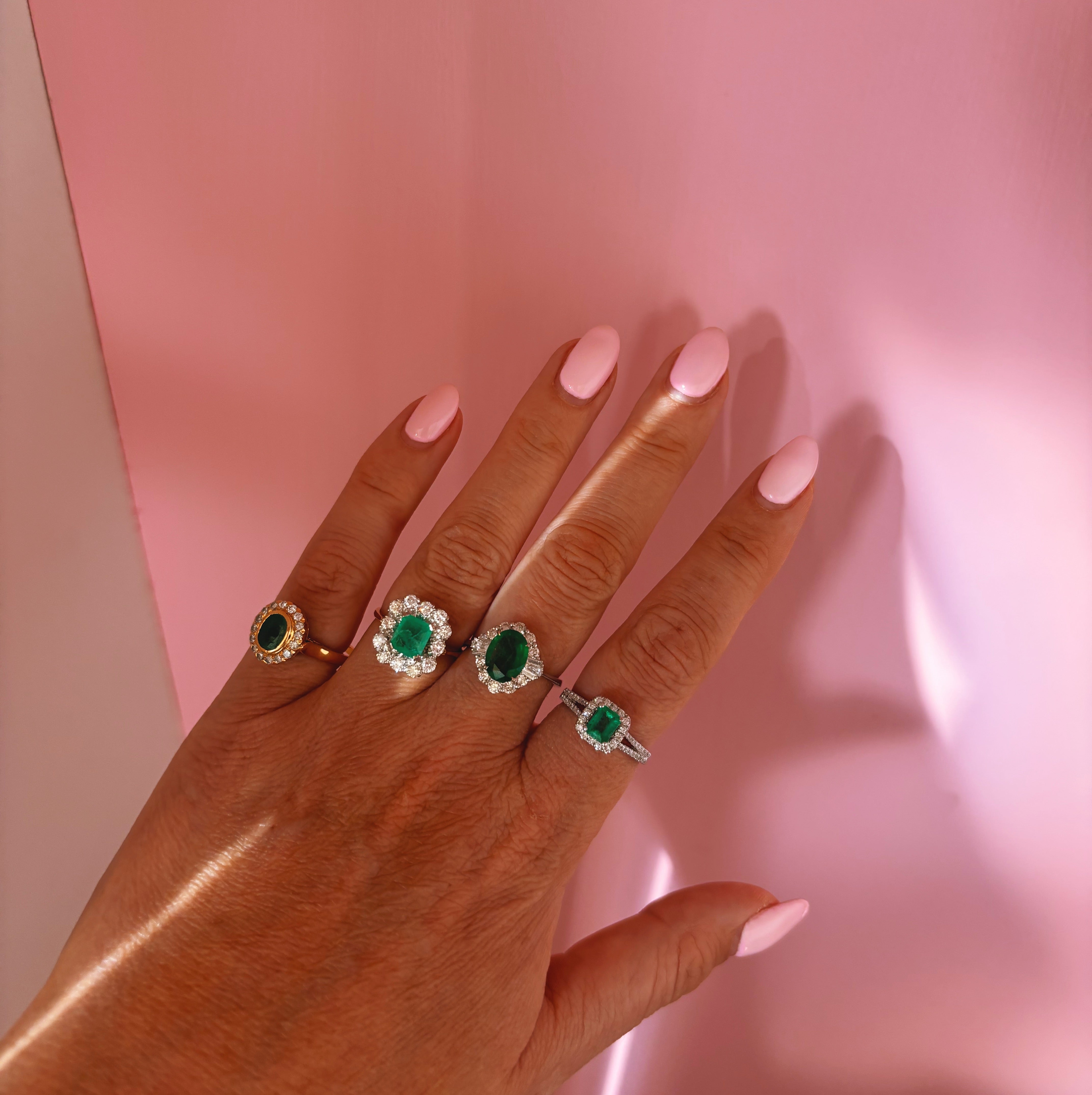 18ct white gold oval emerald and baguette diamond cluster ring