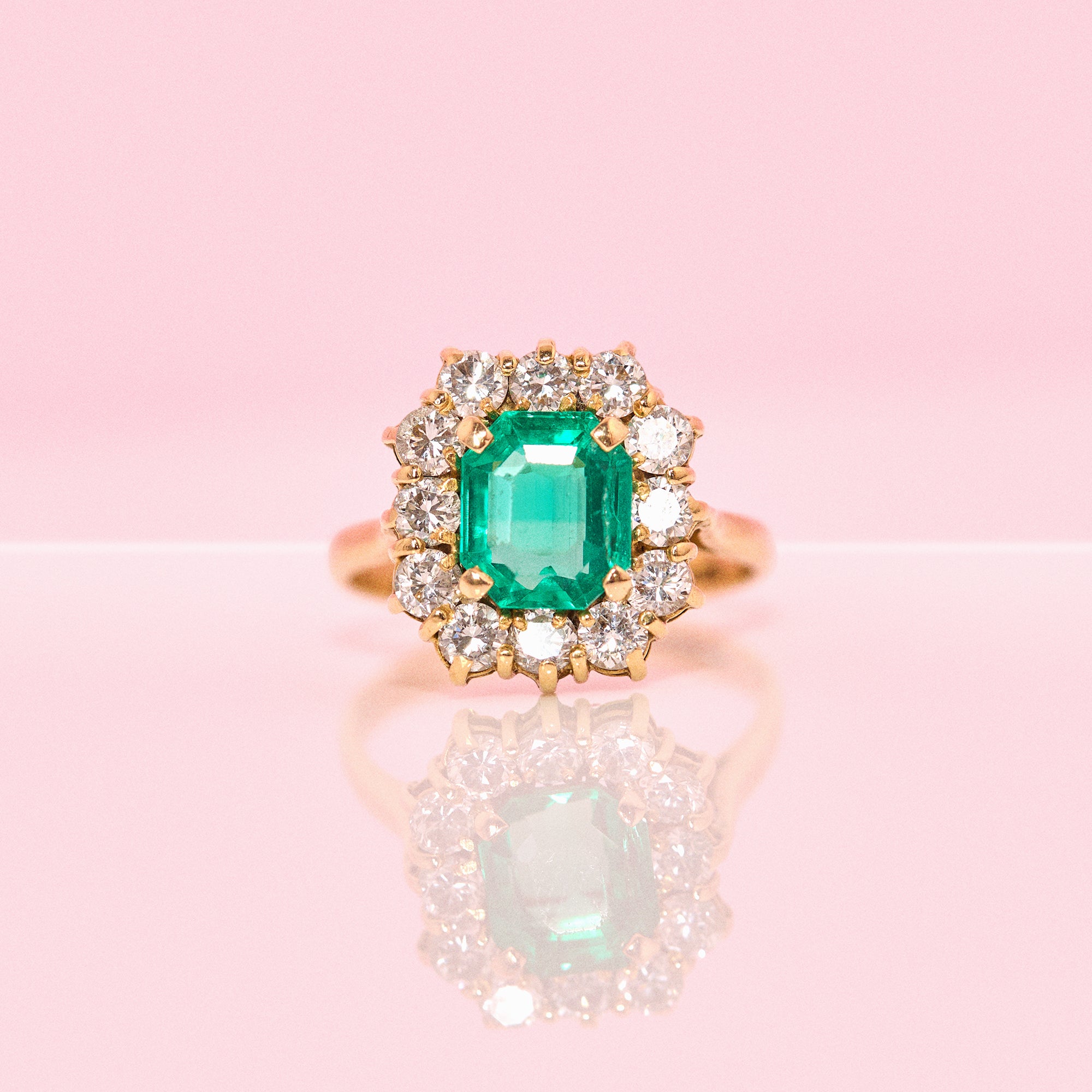 18ct gold emerald and diamond cluster ring