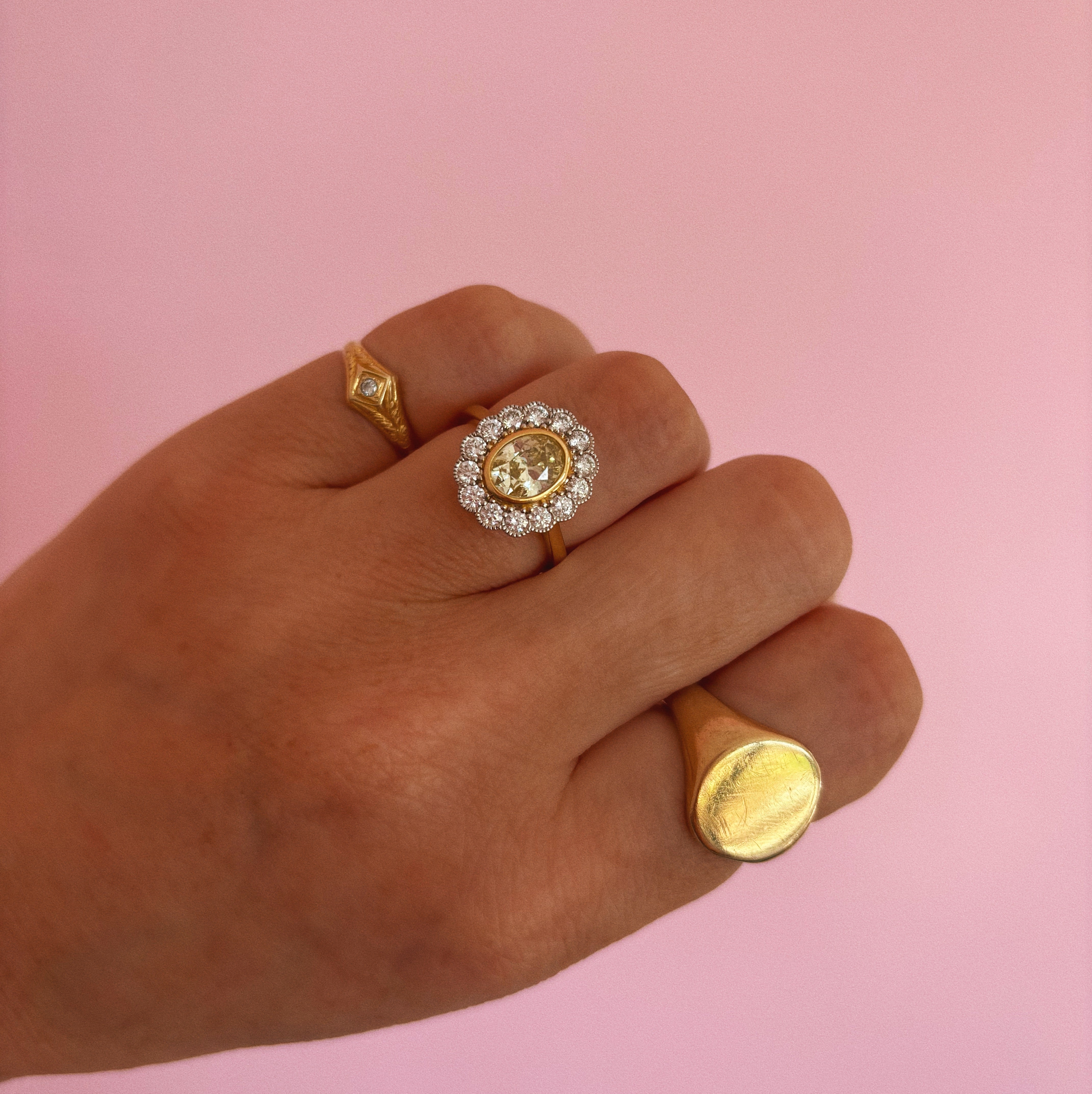 18ct gold 1.0ct oval, yellow diamond flower ring