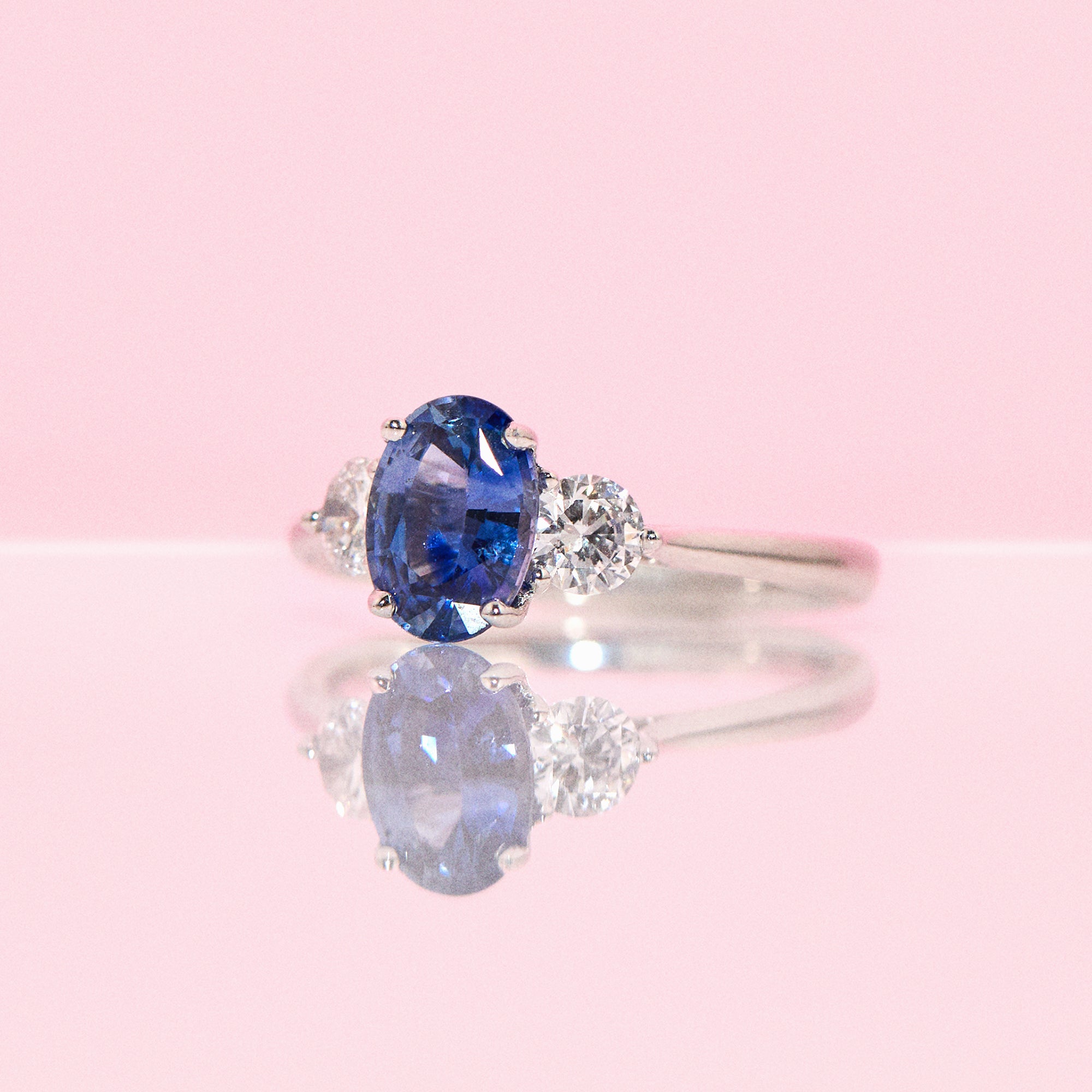 Platinum 1.57ct blue sapphire and diamond three stone ring (made to order)