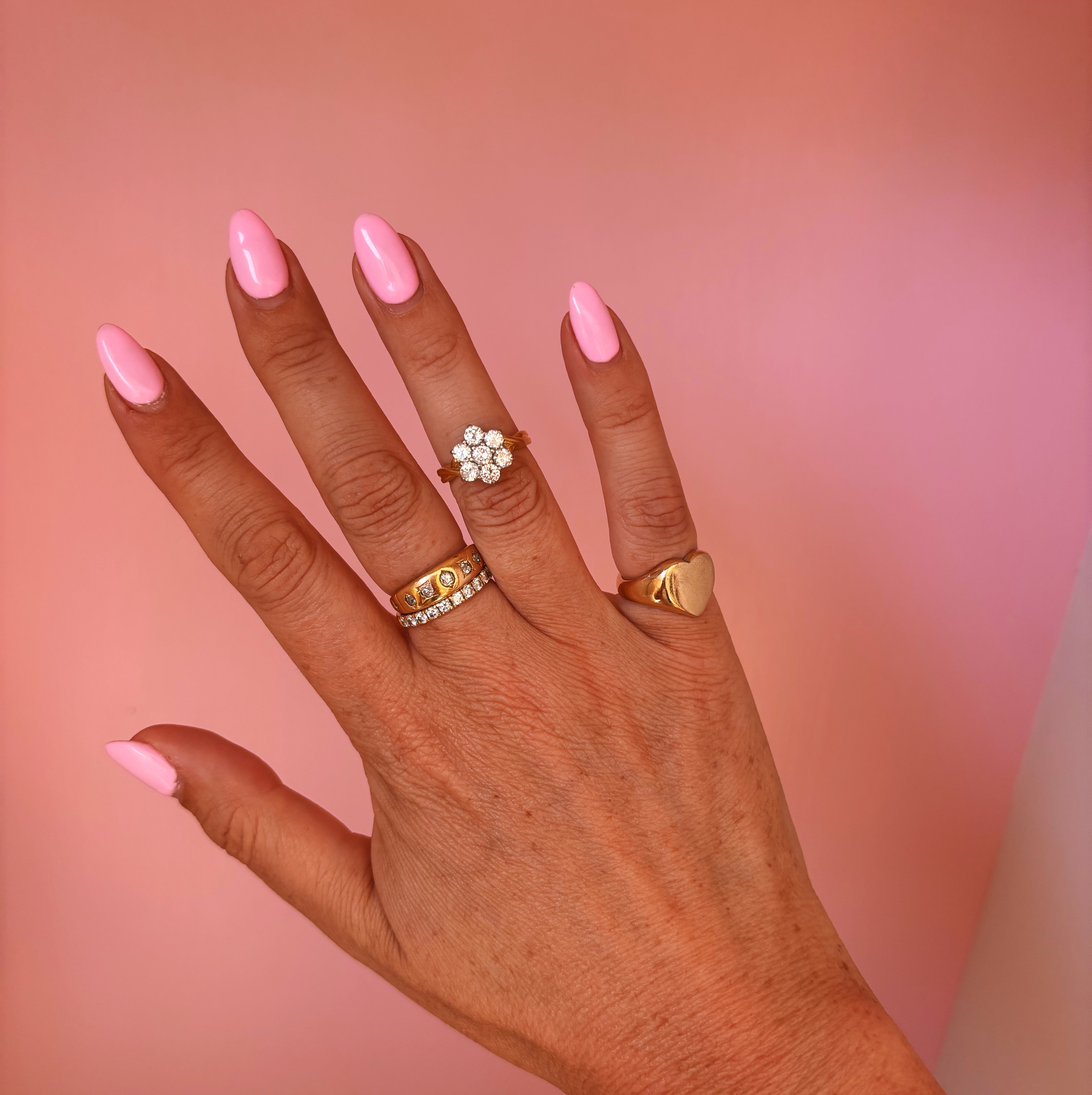 18ct gold diamond flower ring with a twisted band