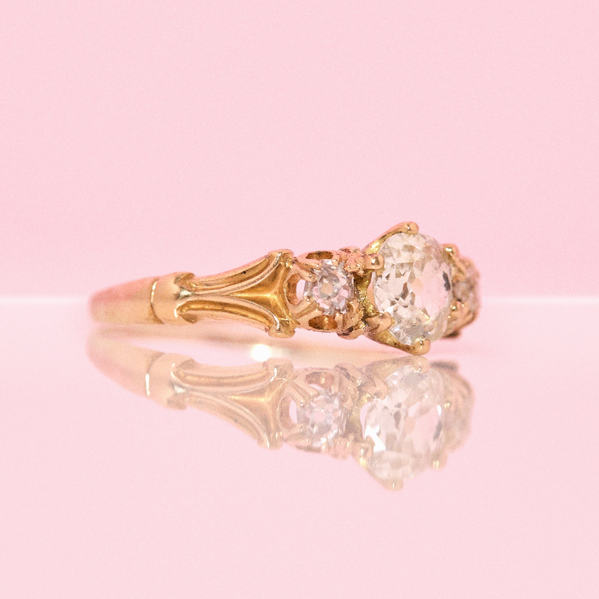 18ct gold old cut diamond three stone ring with carved shoulders