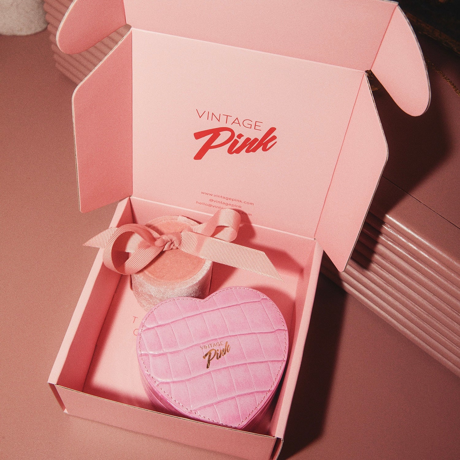 Heart-shaped pink faux croc and red velvet jewellery box