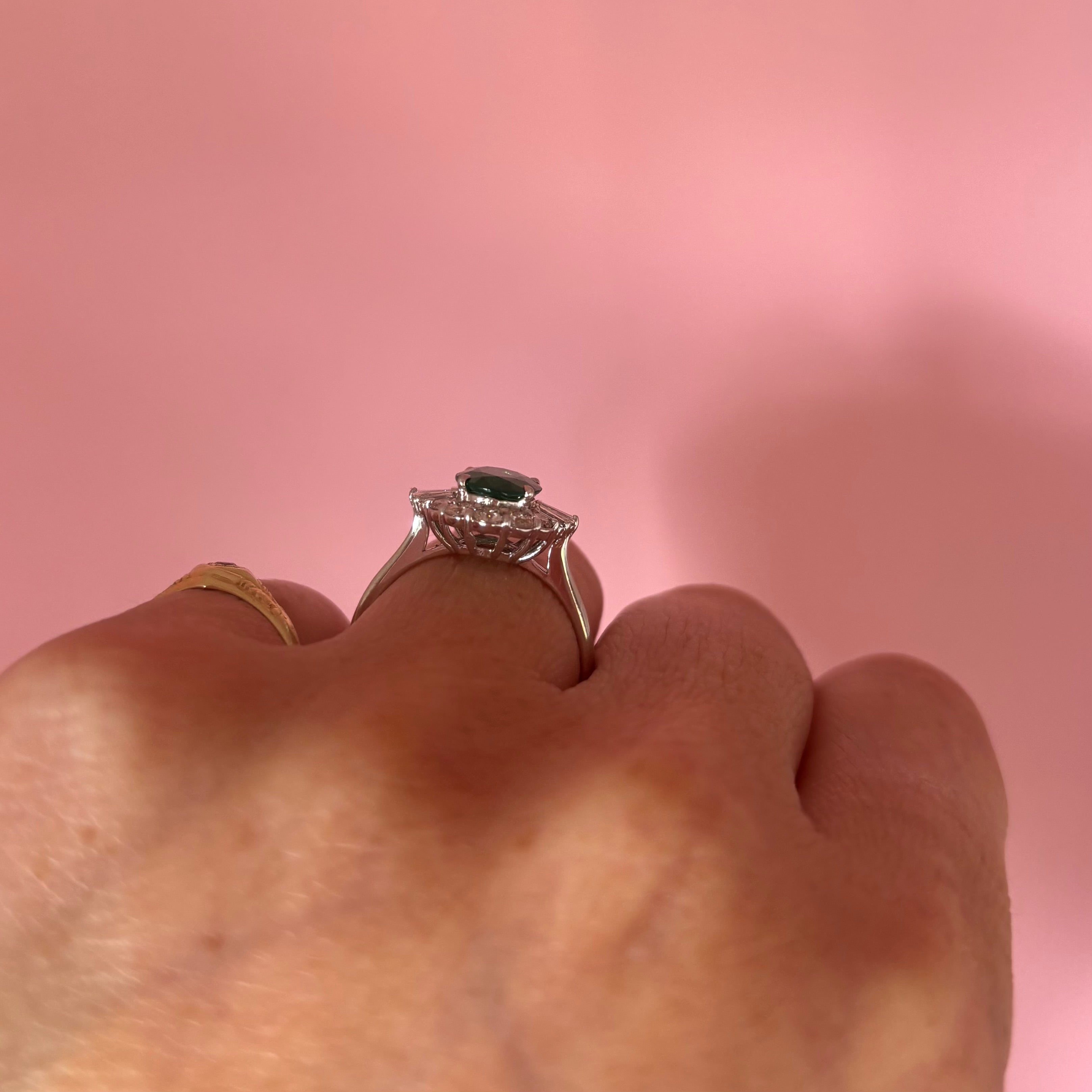 18ct white gold oval emerald and baguette diamond cluster ring