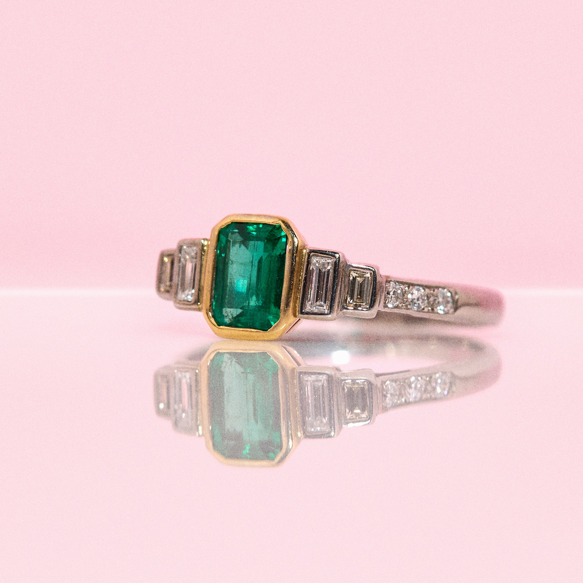 18ct white gold bezel set emerald and diamond ring