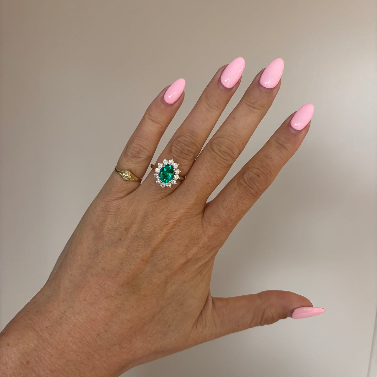 9ct gold 1.93ct oval emerald and 0.88ct diamond cluster ring