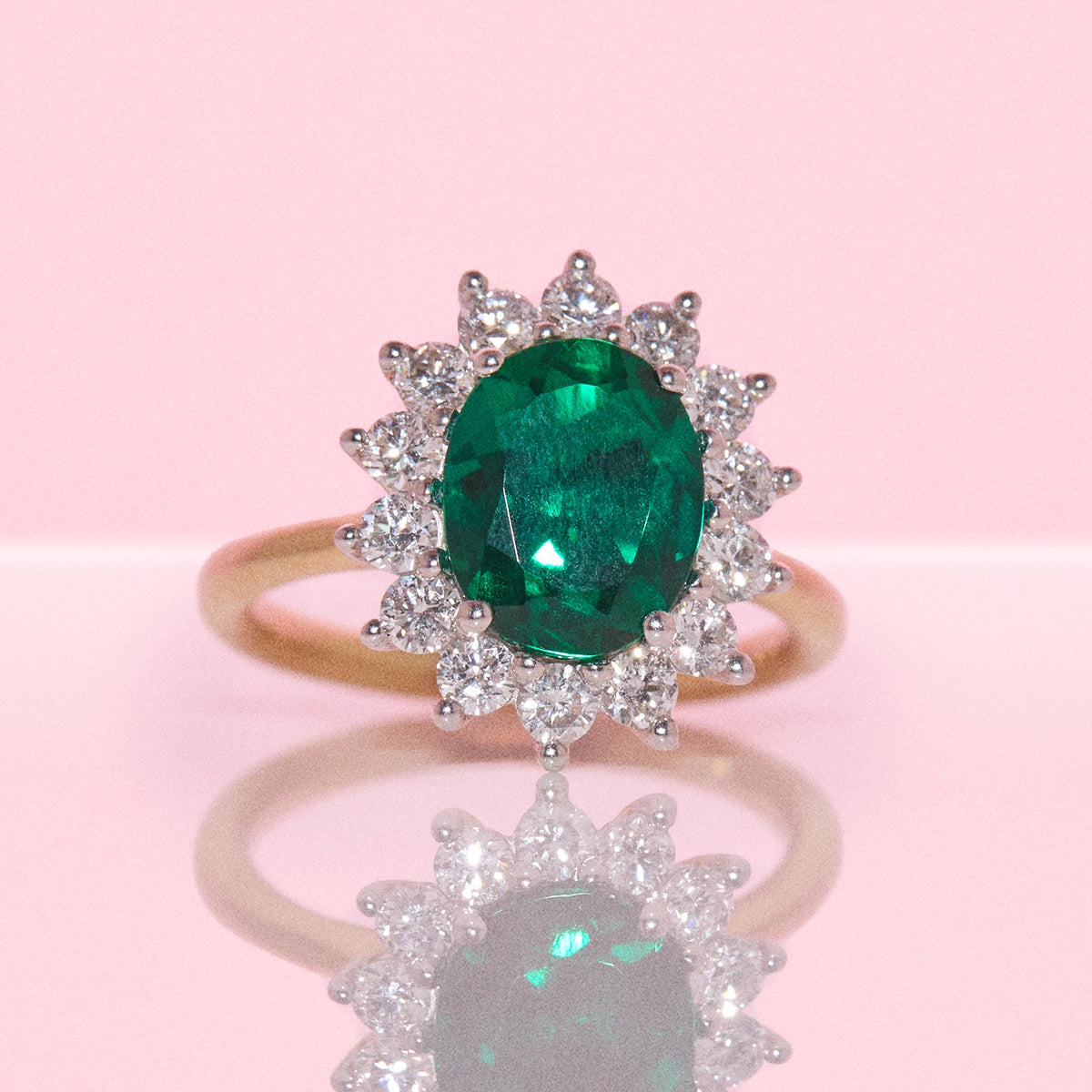 9ct gold 2.28ct oval emerald and 0.83ct diamond cluster ring