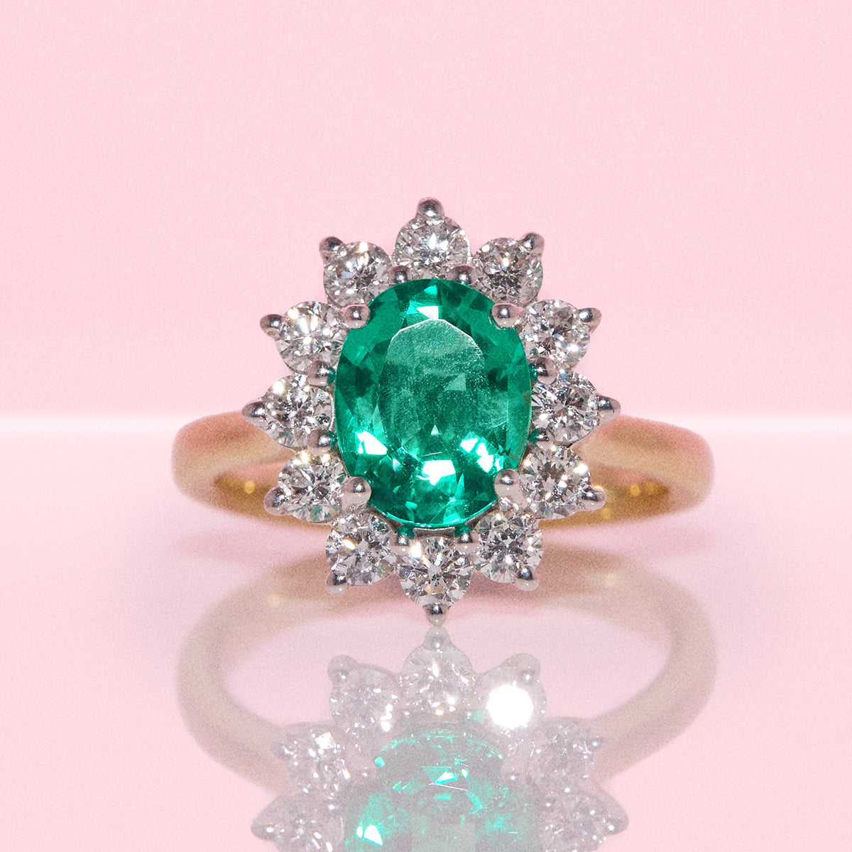 9ct gold 1.93ct oval emerald and 0.88ct diamond cluster ring