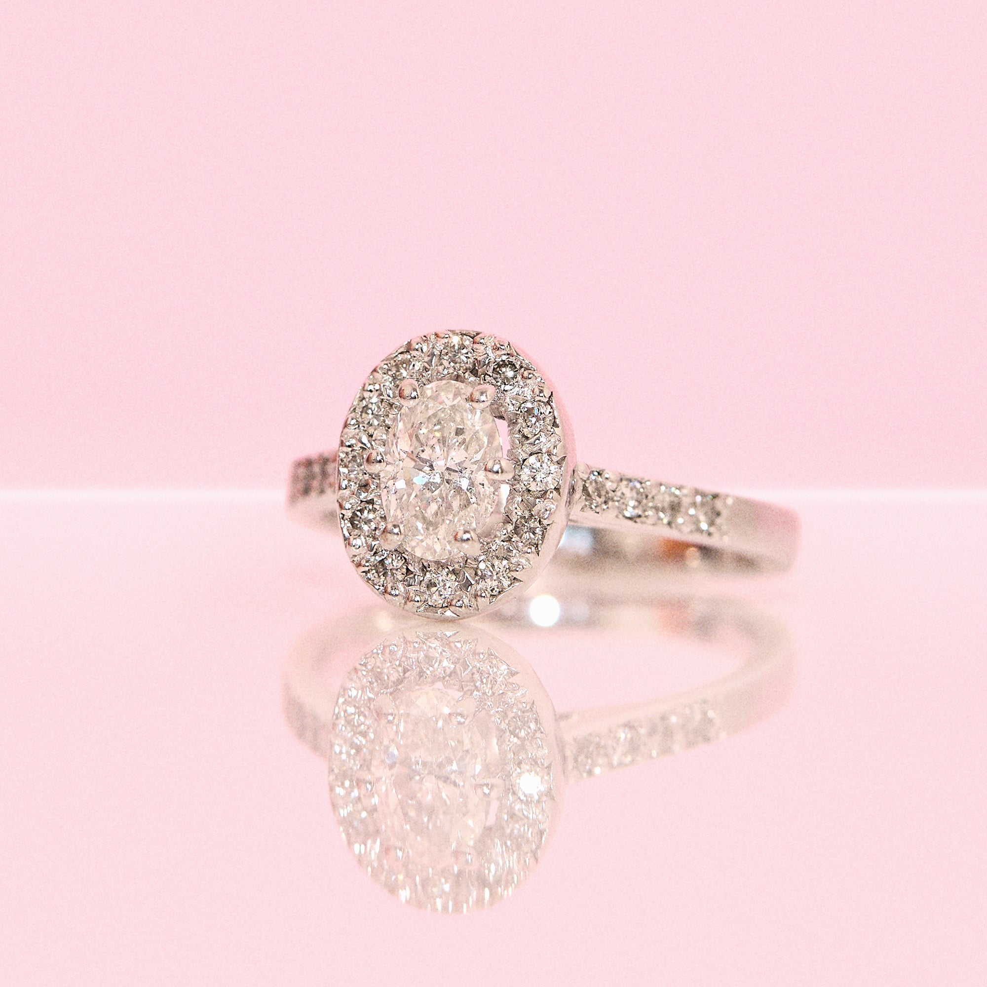 18ct white gold 0.75ct oval diamond cluster half-eternity ring