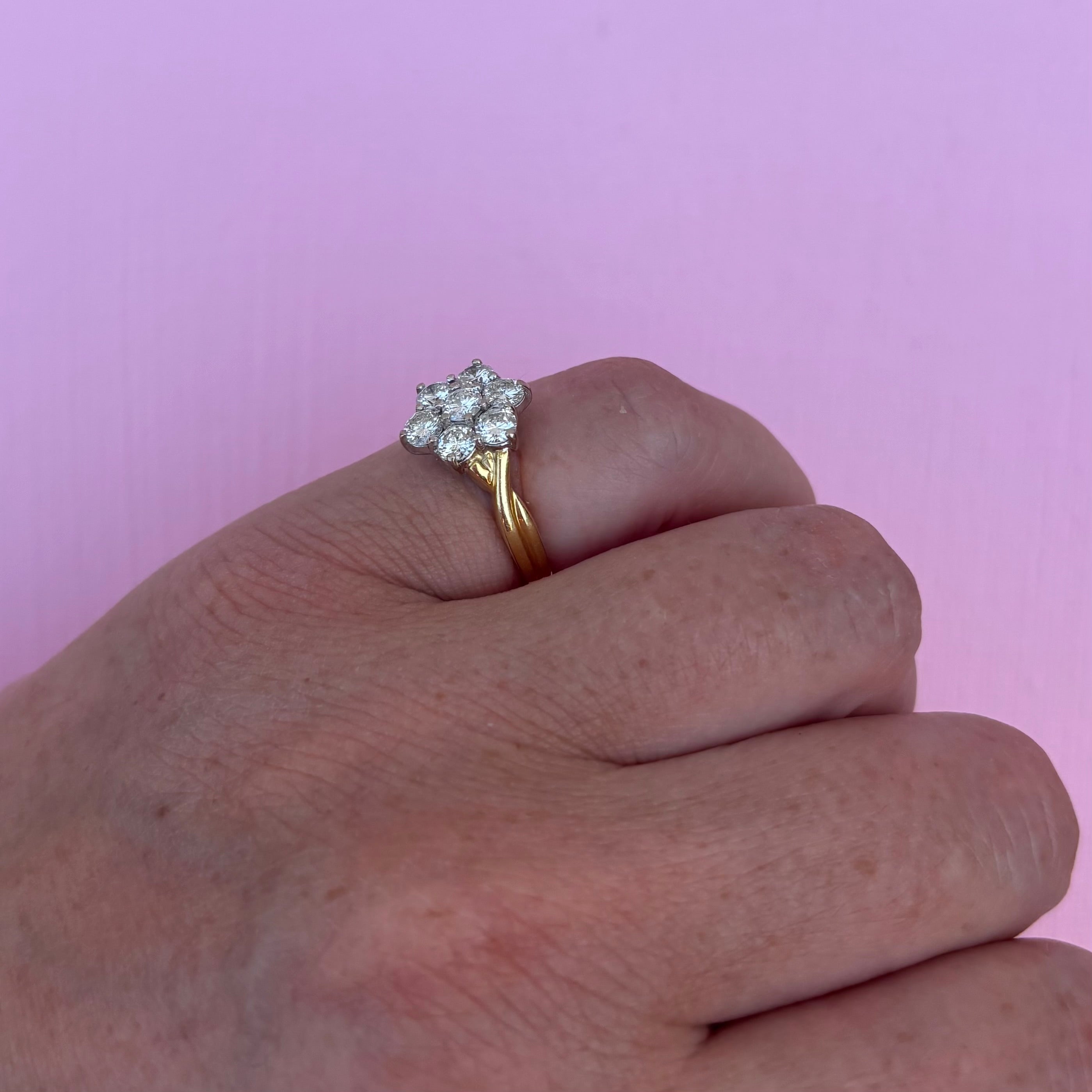 18ct gold diamond flower ring with a twisted band