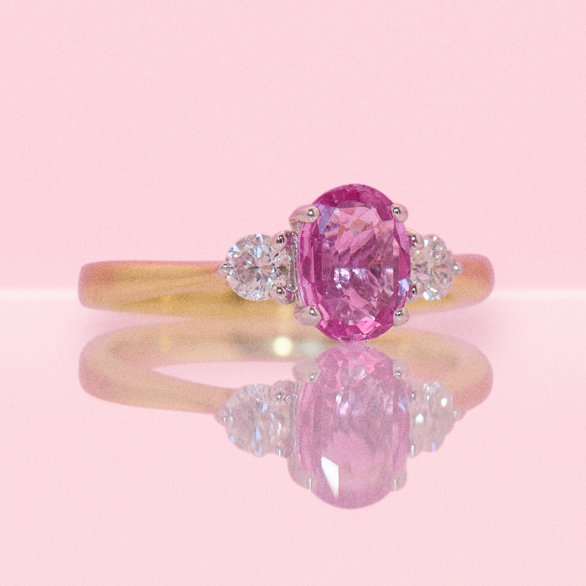 18ct gold 1.22ct pink sapphire and 0.25ct diamond three stone ring