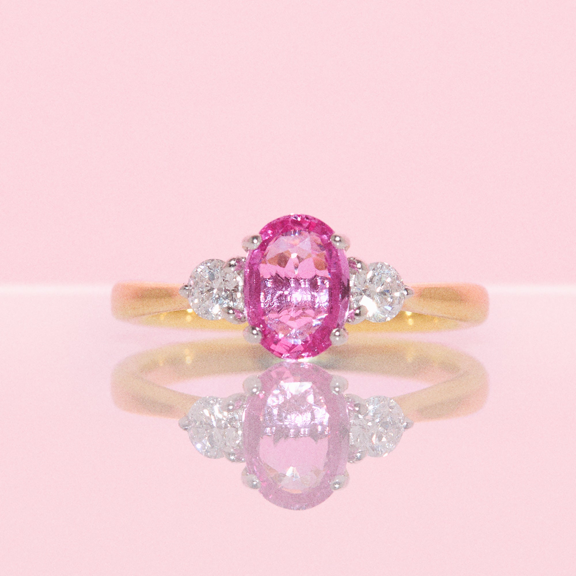 18ct gold 1.22ct pink sapphire and 0.25ct diamond three stone ring