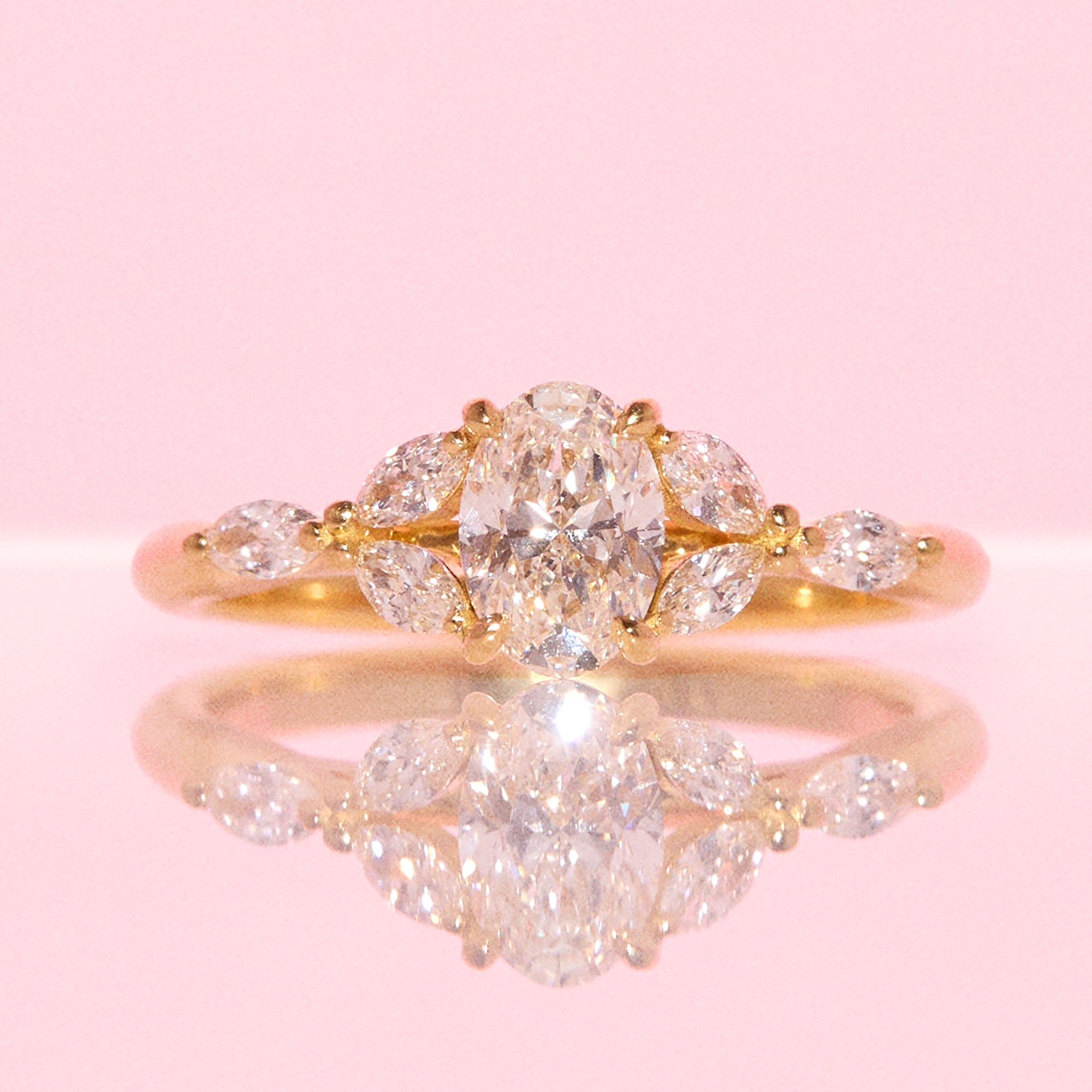 18ct gold 0.70ct oval diamond cluster ring (made to order)