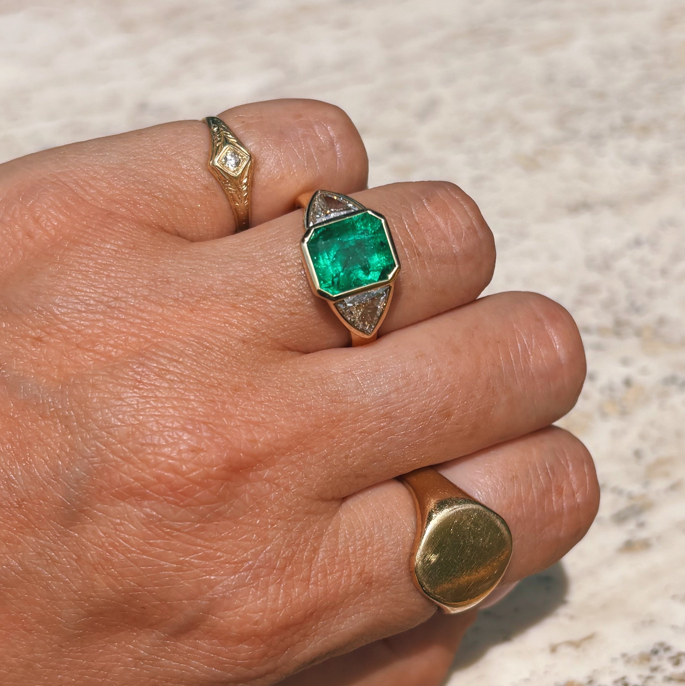 18ct gold 3.0ct Columbian Octagonal-cut emerald and 1.0ct diamond bezel set ring