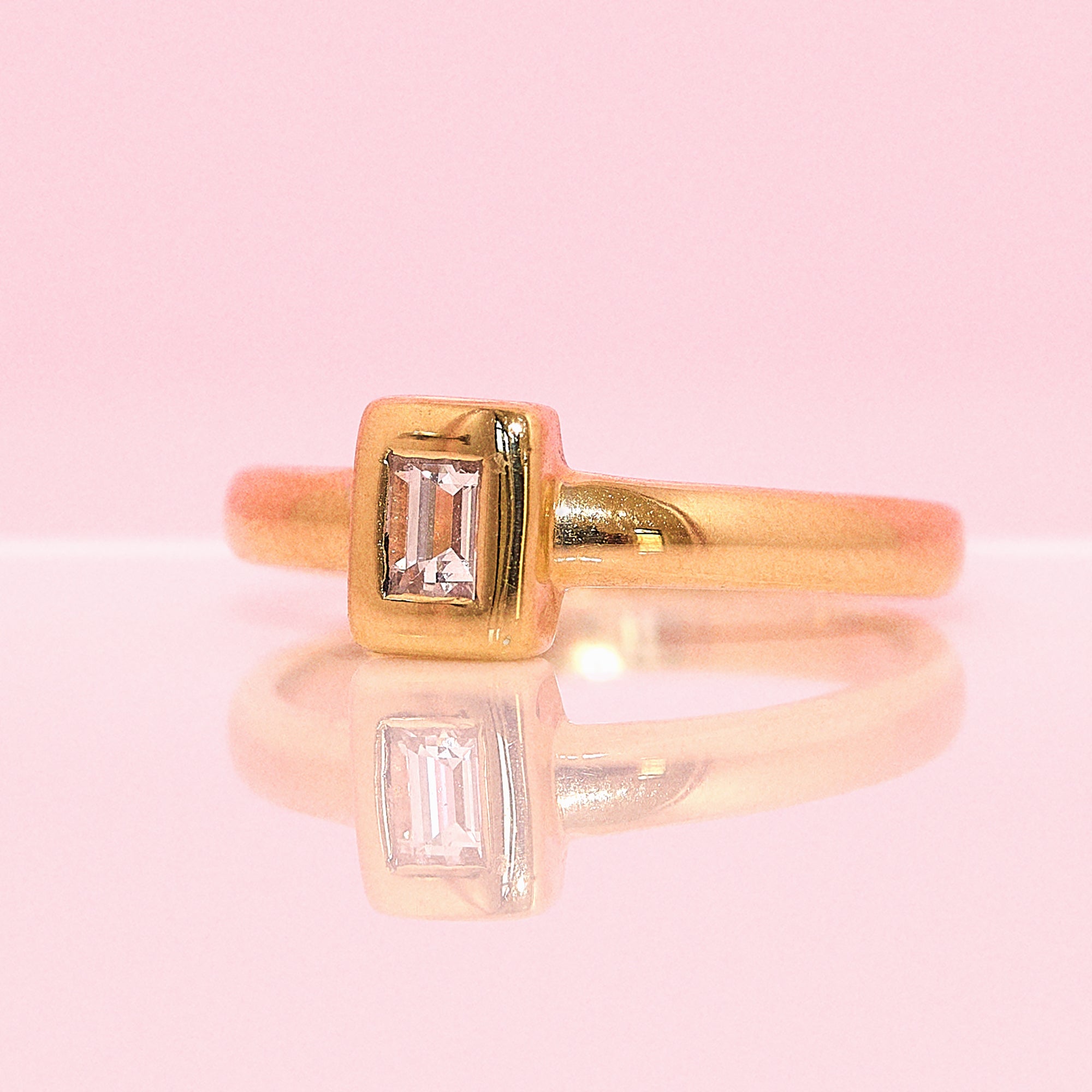 18ct gold bezel set emerald cut 0.25ct diamond ring
