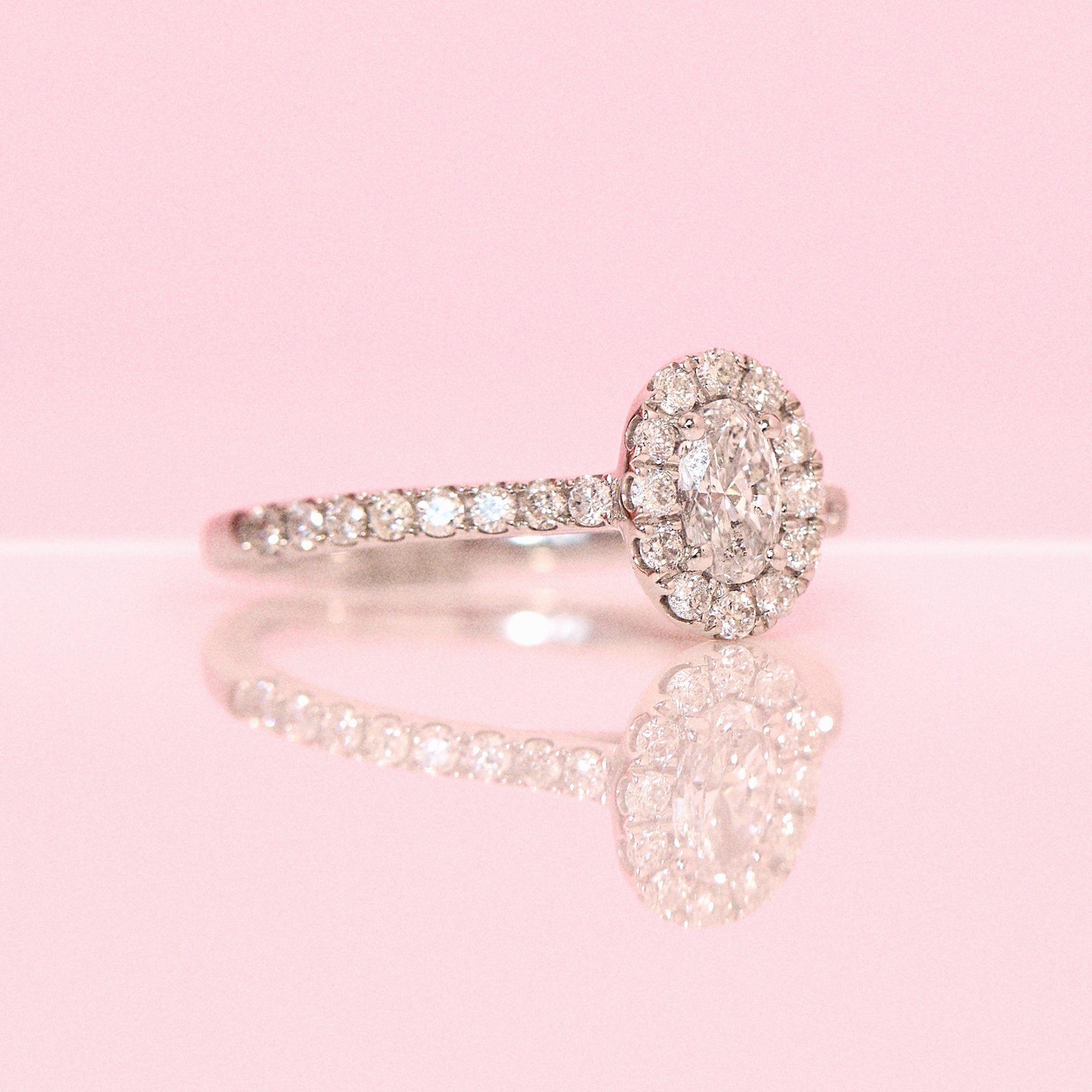 Platinum 0.62ct oval half-eternity diamond ring