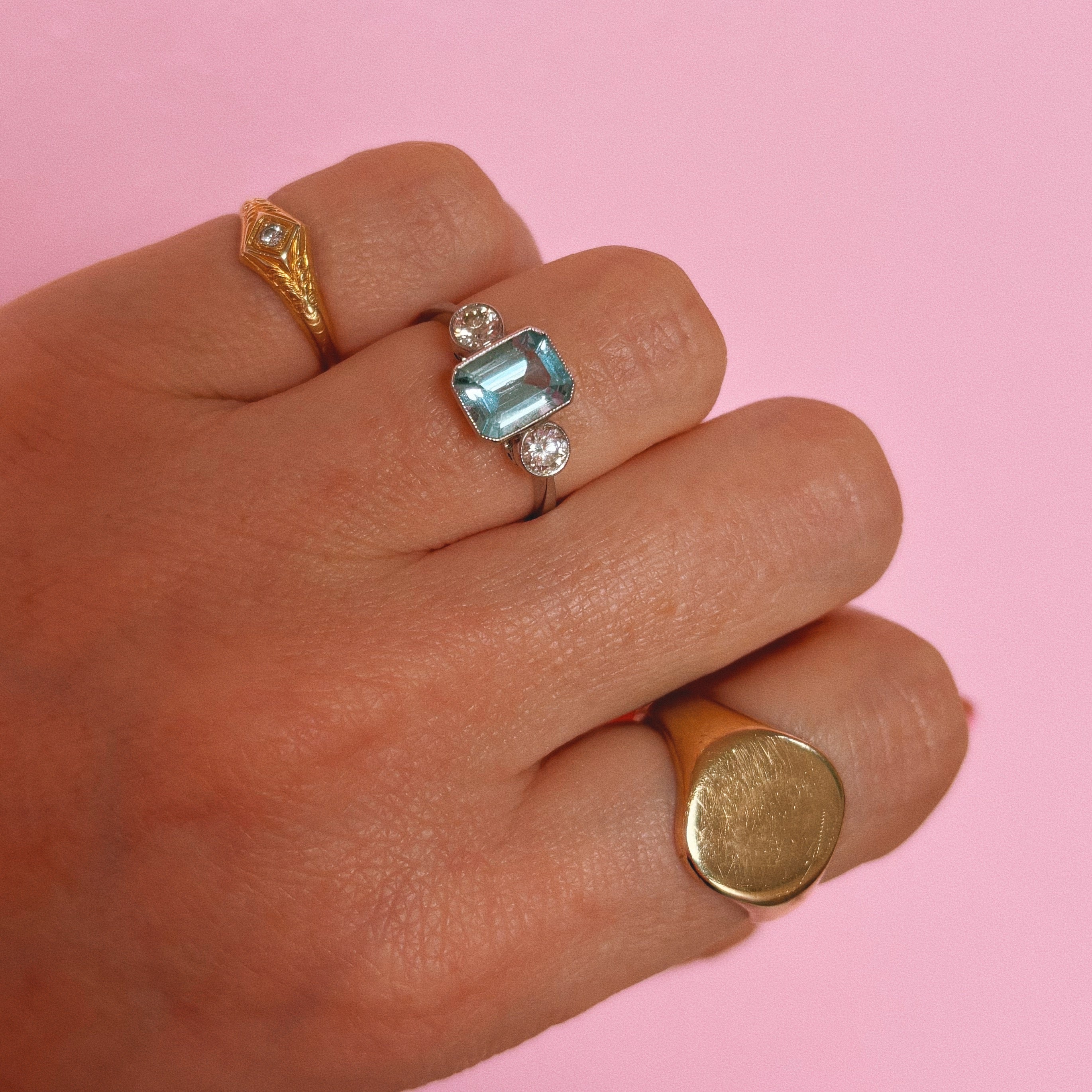 Platinum 1.40ct emerald cut aquamarine and diamond three stone ring