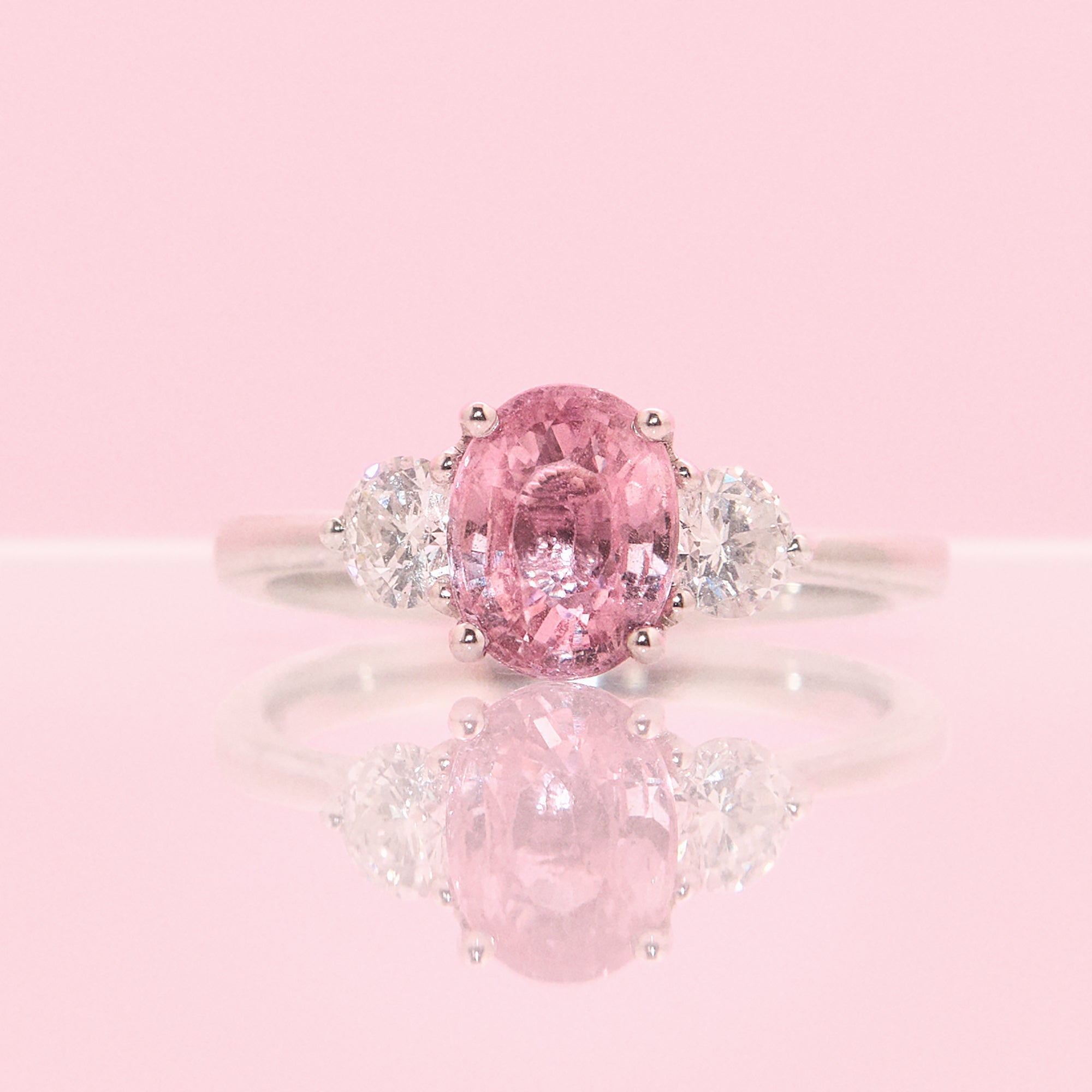 Platinum 1.24ct pink sapphire and 0.43ct diamond three stone ring (made to order)