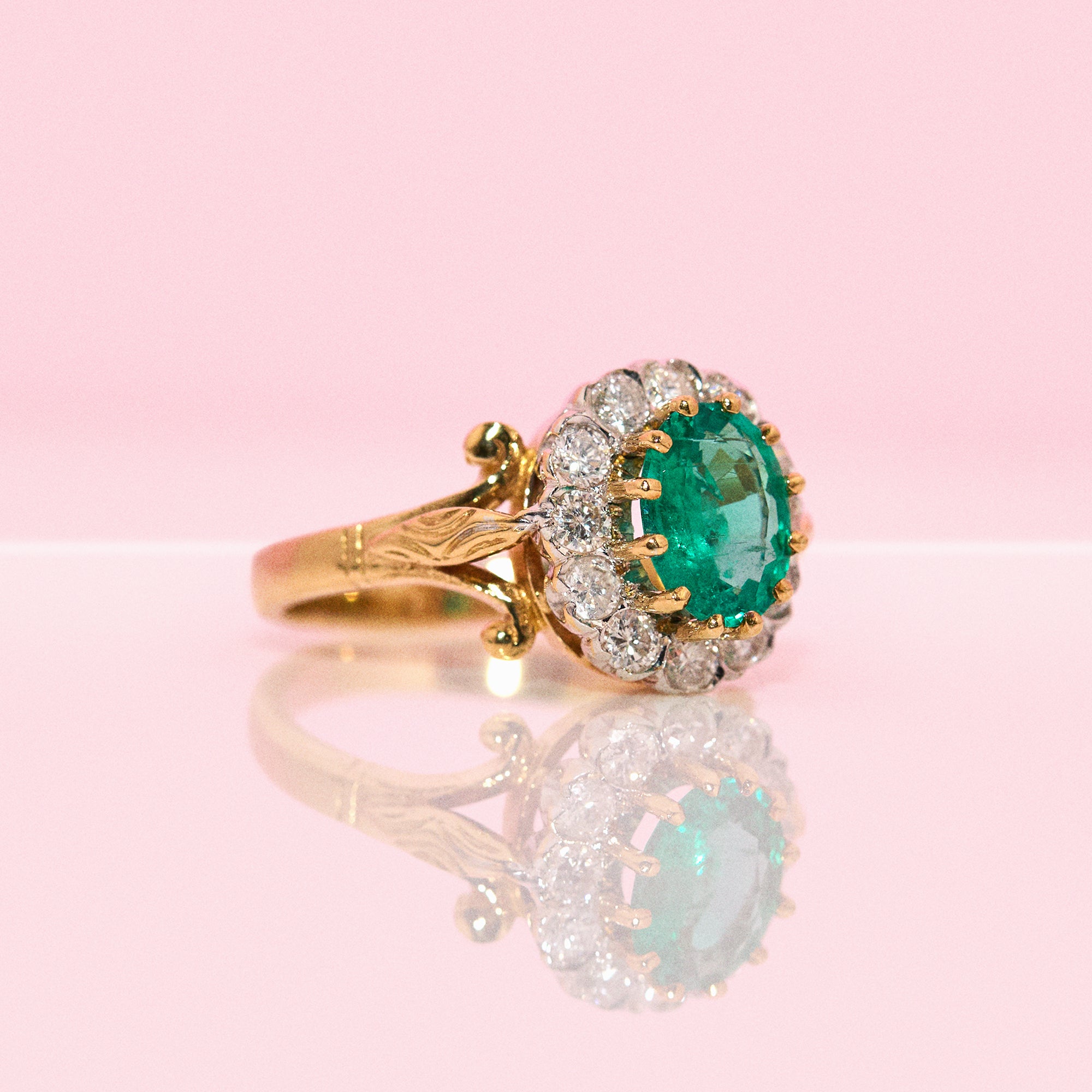 18ct gold 1.46ct emerald and diamond cluster ring