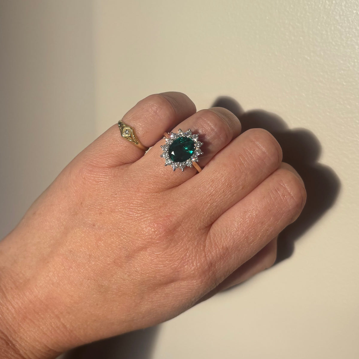 9ct gold 1.93ct oval emerald and 0.88ct diamond cluster ring (lab grown)