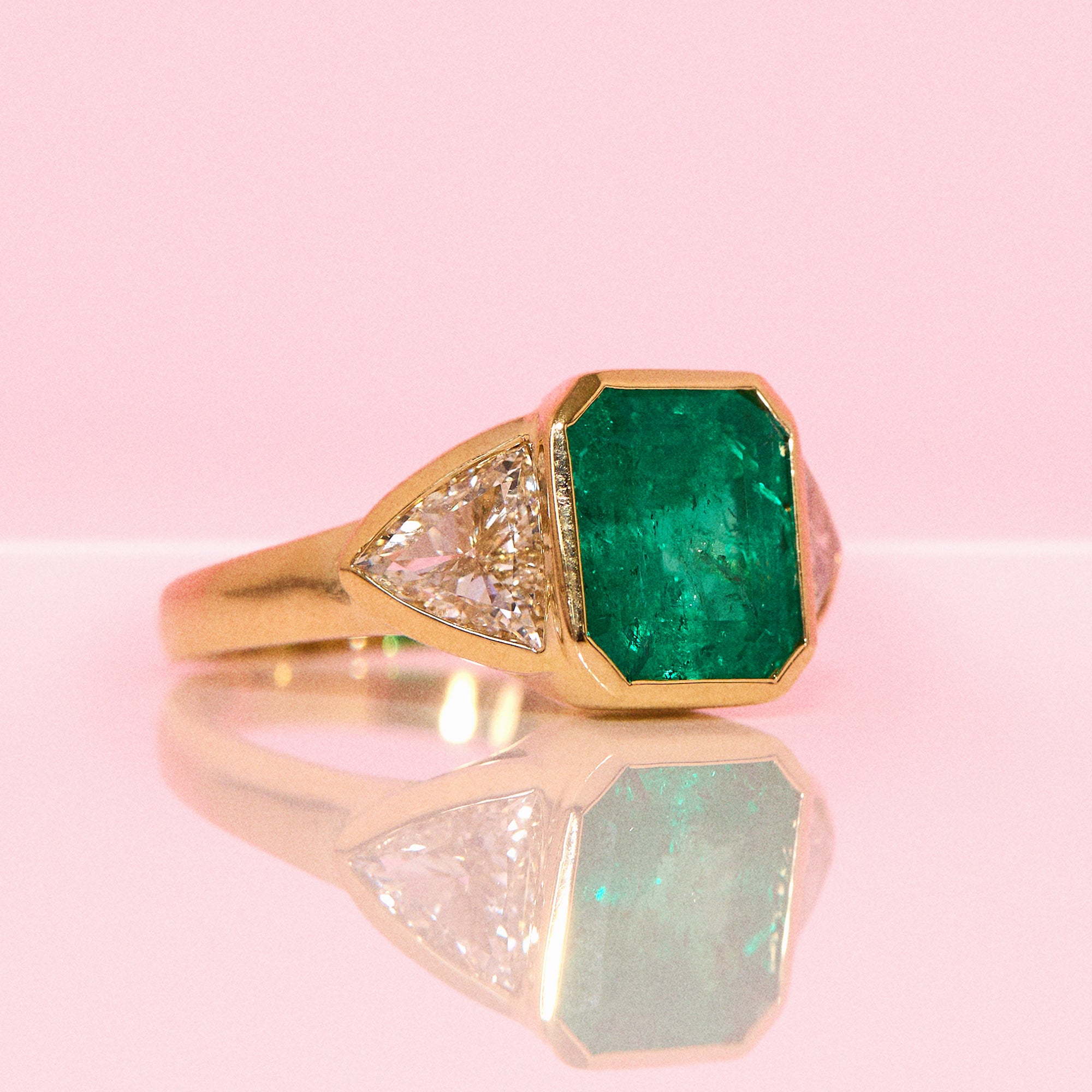 18ct gold 3.0ct Columbian Octagonal-cut emerald and 1.0ct diamond bezel set ring