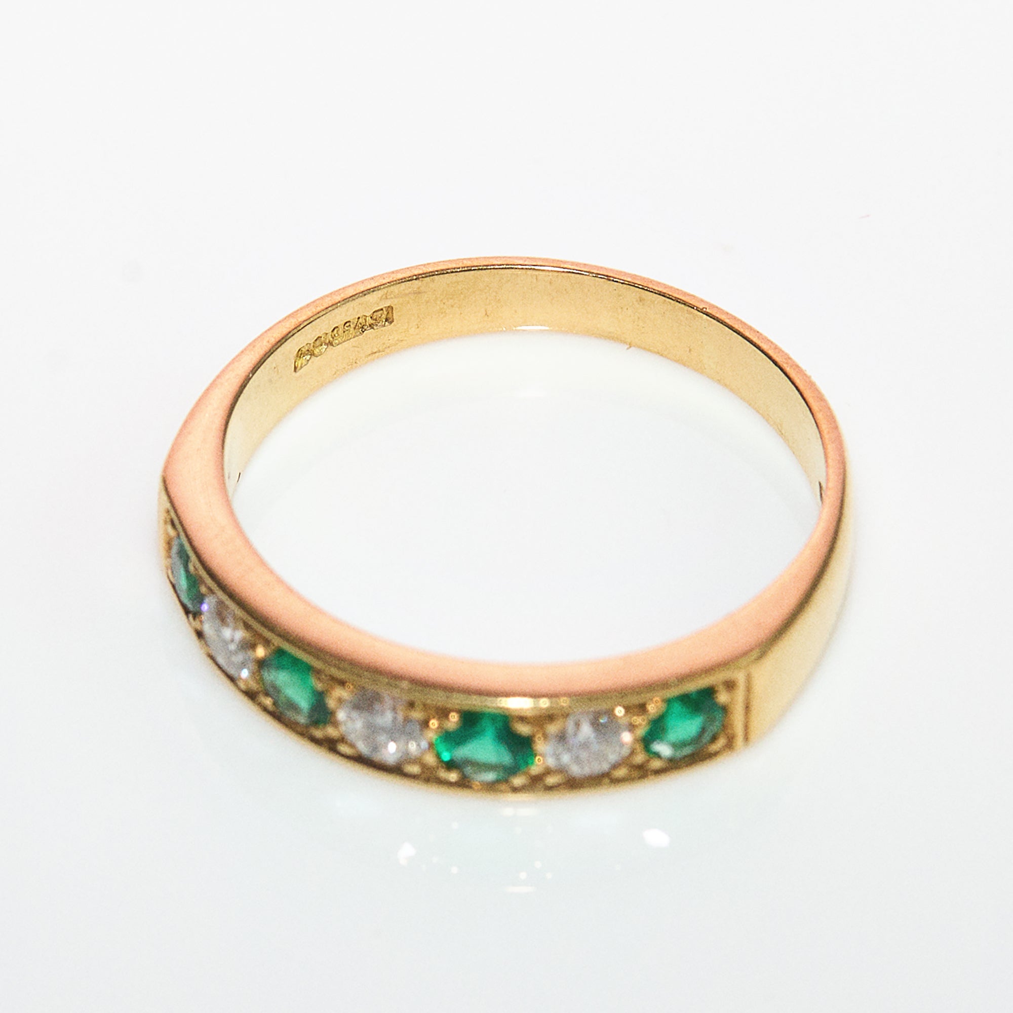 18ct gold emerald and diamond half eternity ring