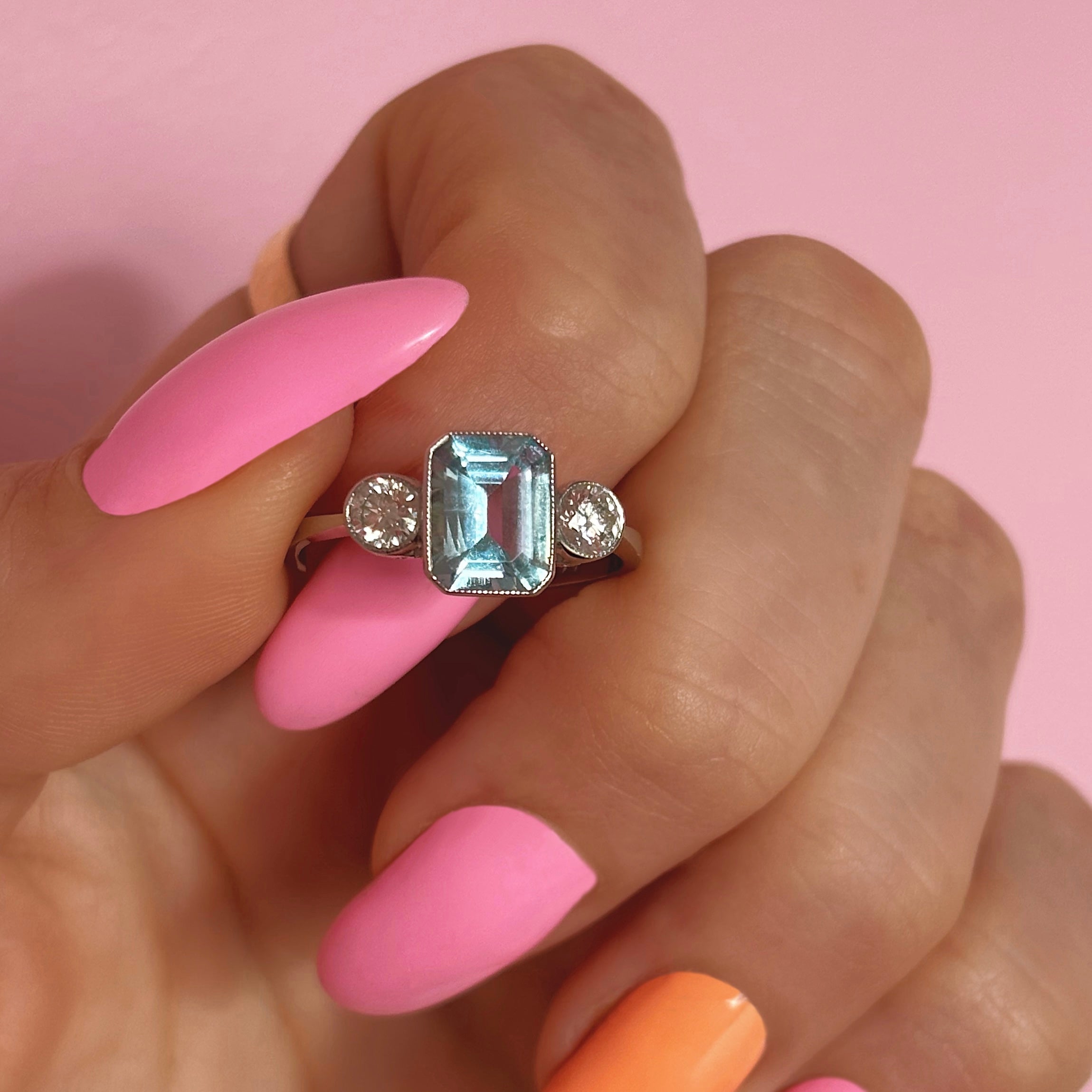 Platinum 1.40ct emerald cut aquamarine and diamond three stone ring