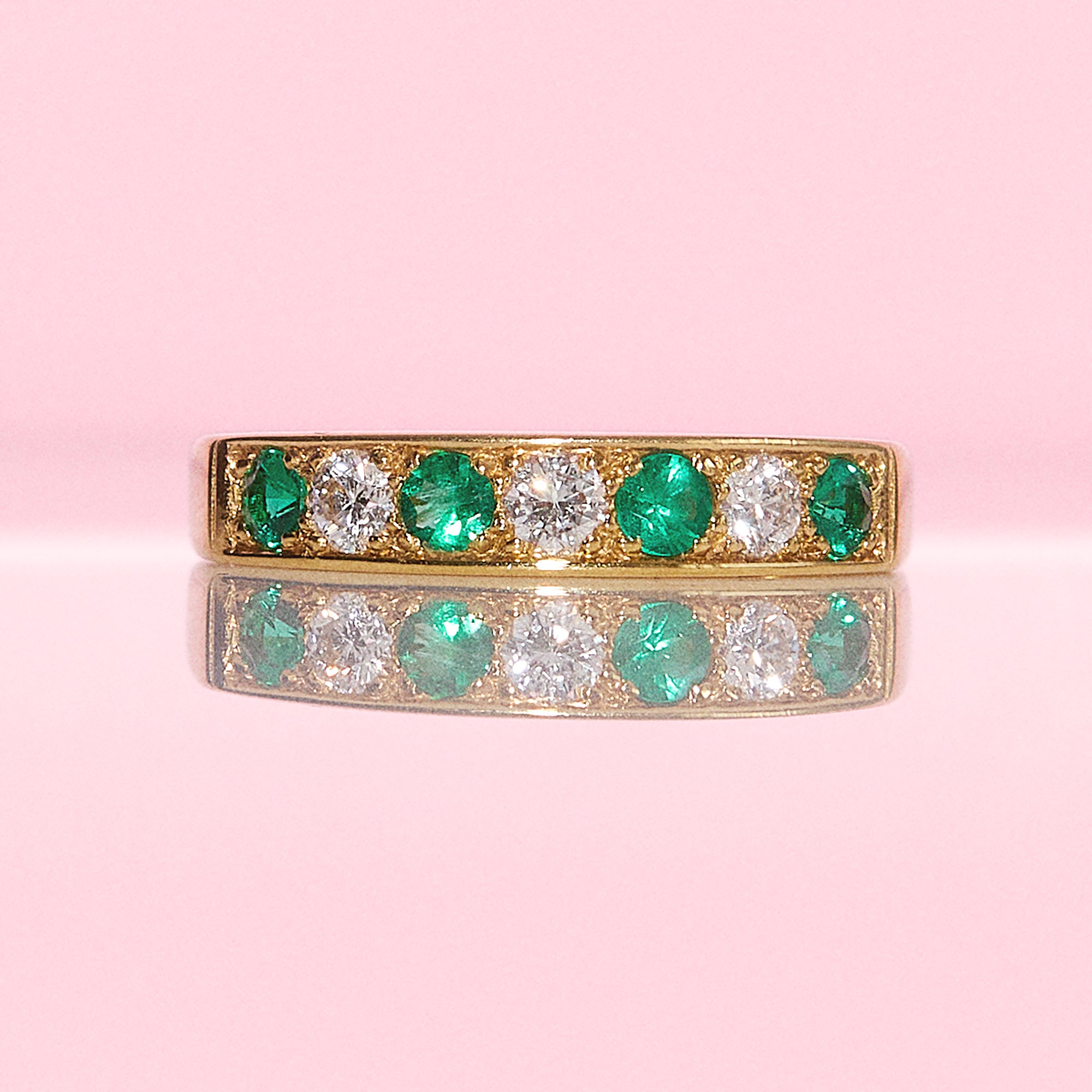 18ct gold emerald and diamond half eternity ring