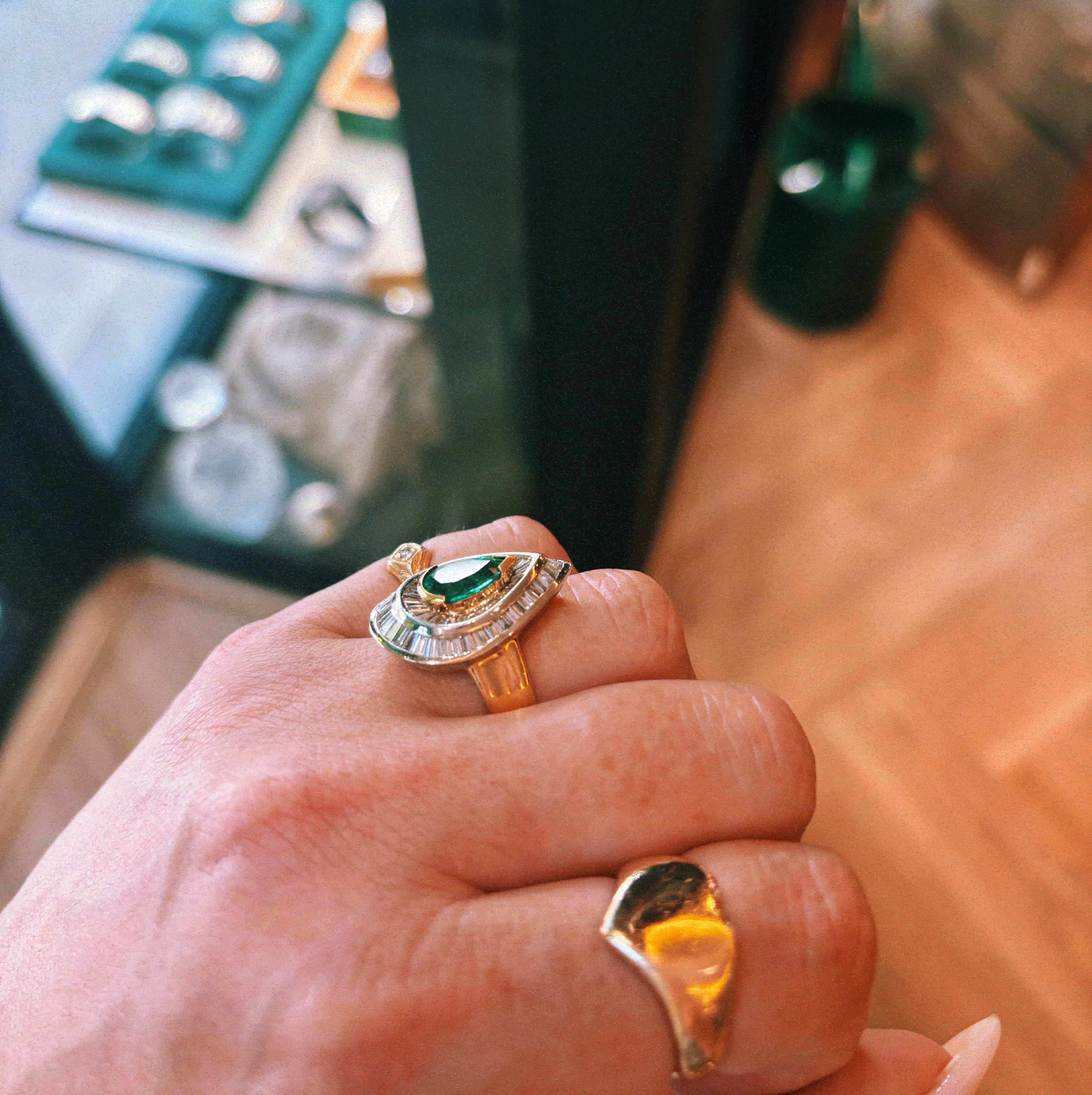 18ct gold emerald and baguette diamond cluster ring