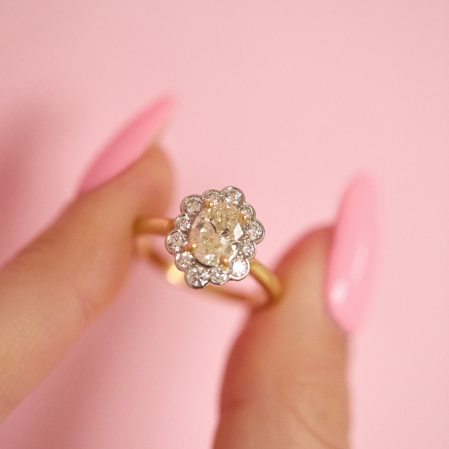 18ct gold 1.20ct oval diamond flower ring