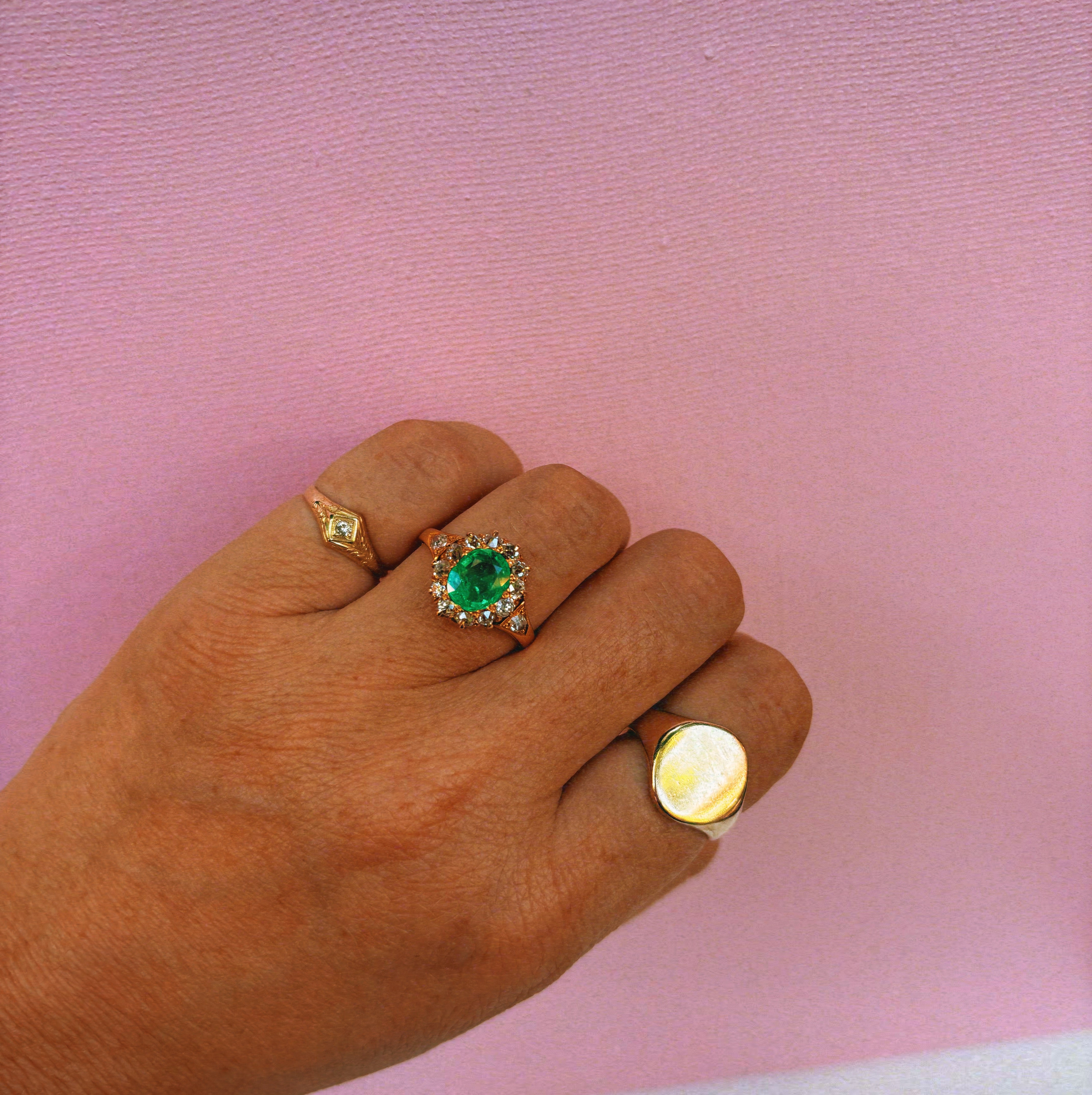 18ct gold emerald and diamond cluster ring